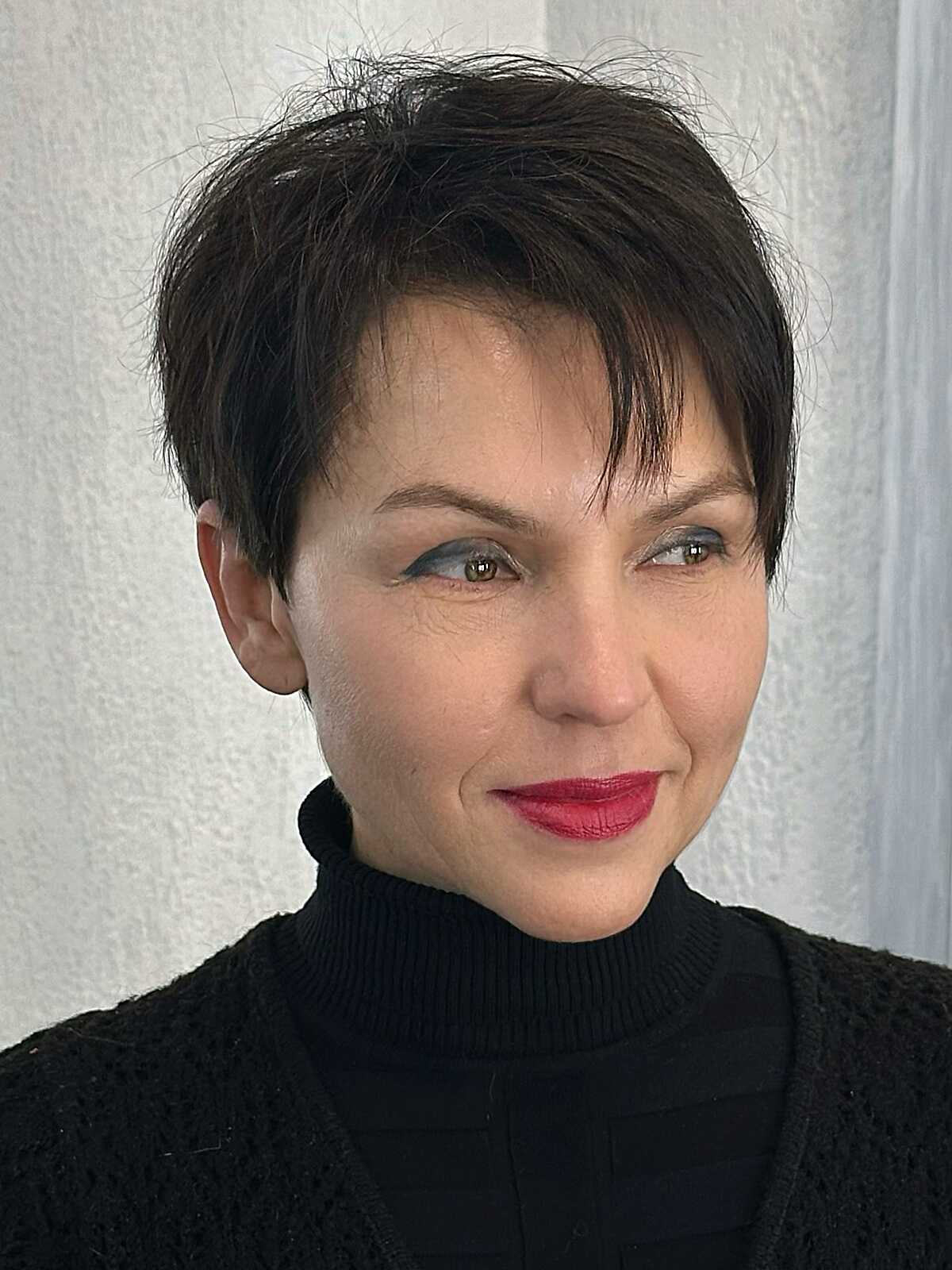 Dark brunette bixie with wispy texture and red lipstick