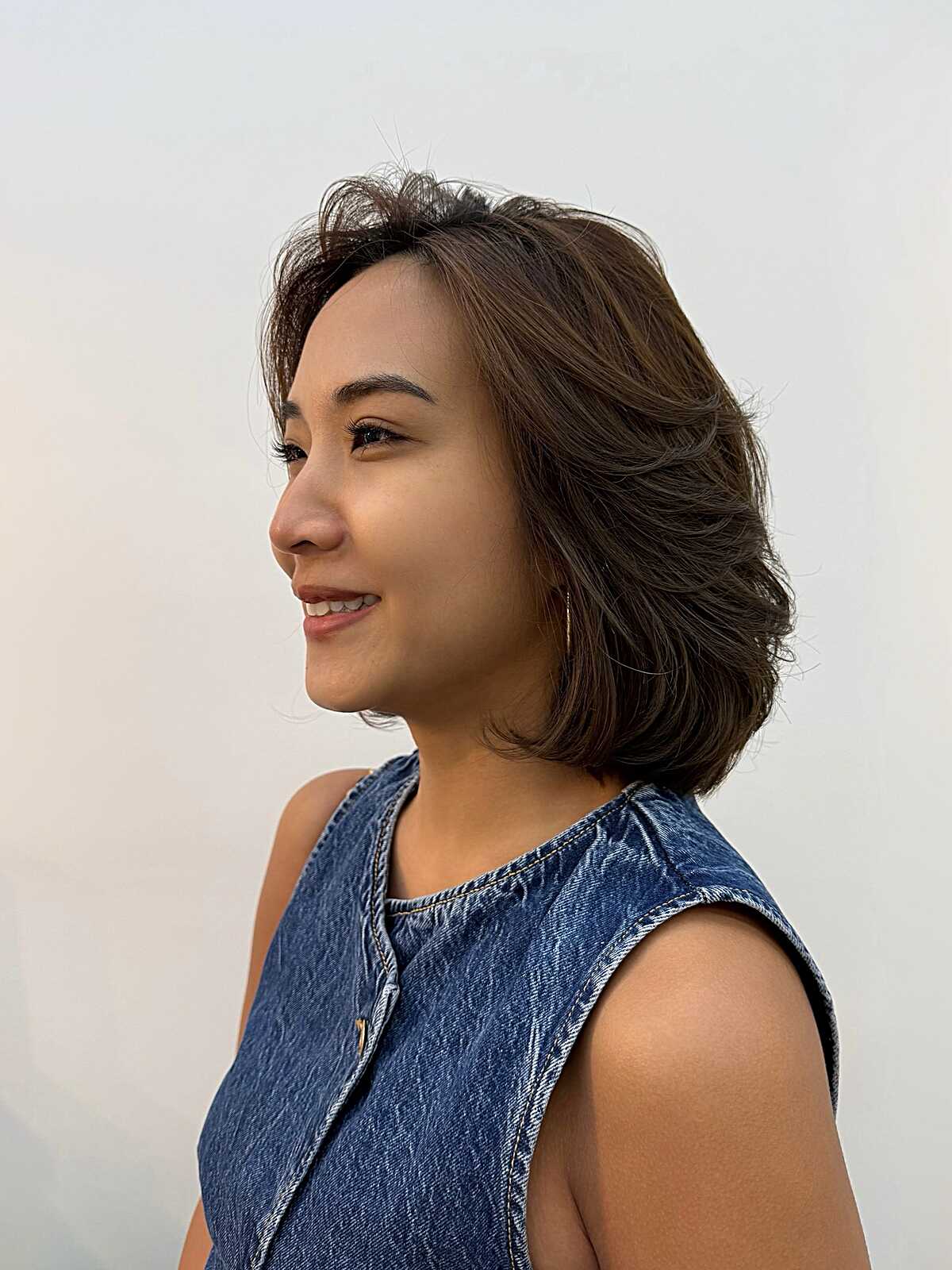 Dark brown layered bob with flipped ends and side part