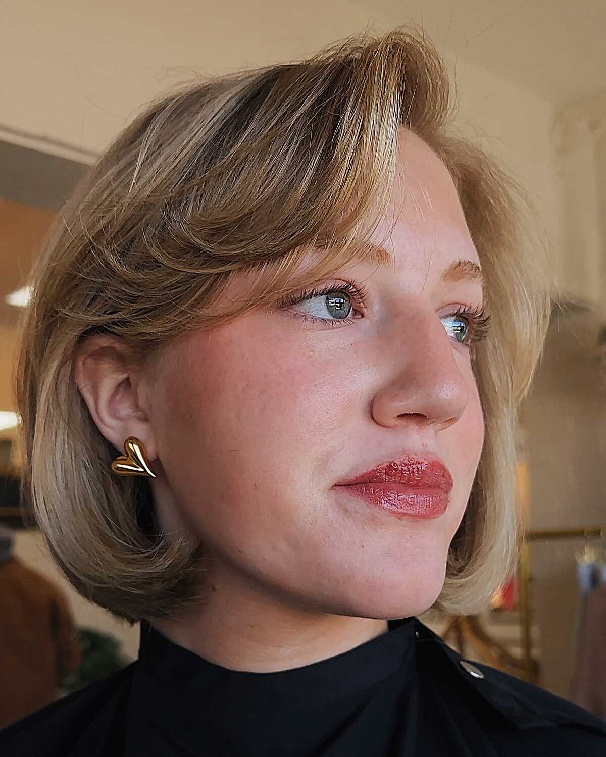 Short honey caramel bob with soft waves and side part