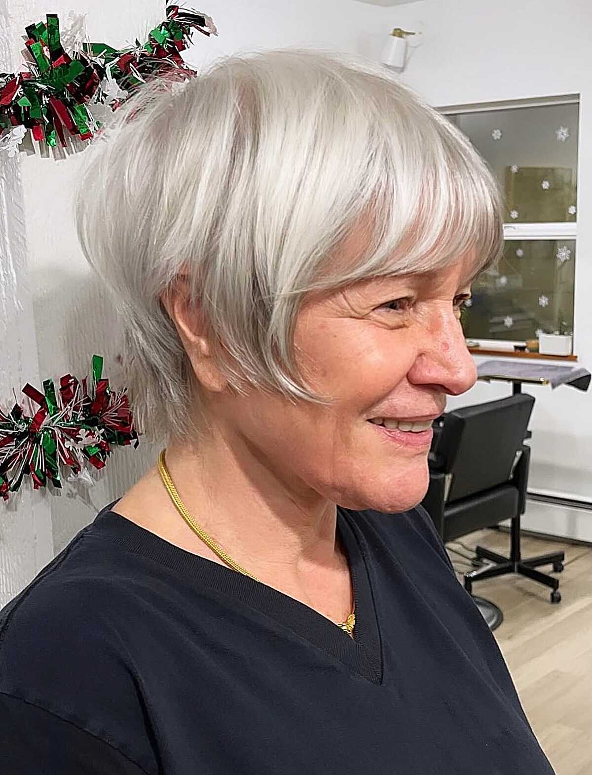 Icy white bixie with heavy bangs and layered sides