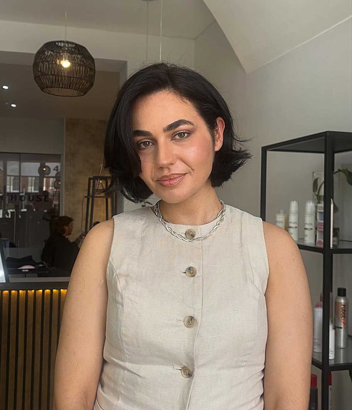 Short black chin-length bob with tousled texture