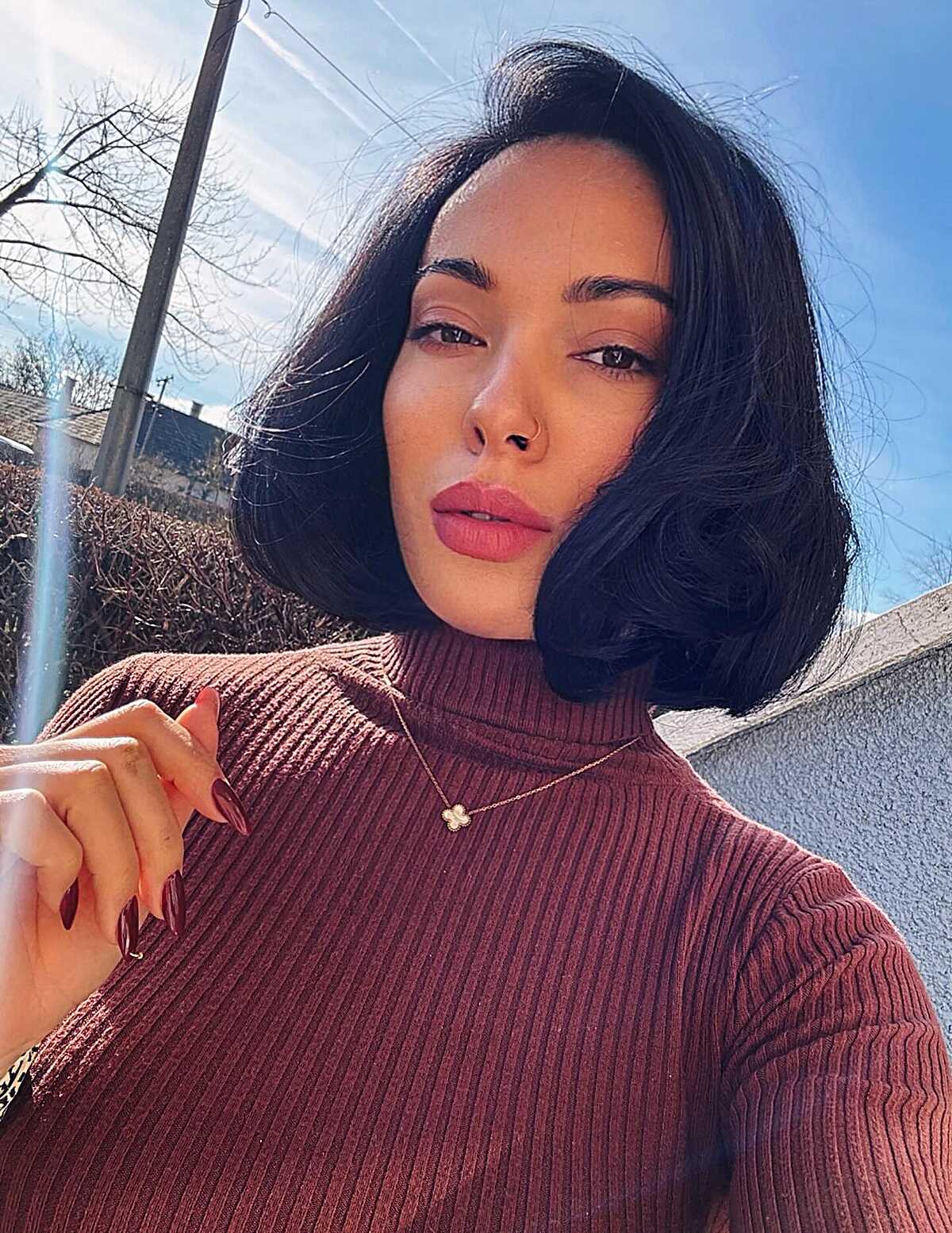 Black chin-length bob with curled-under ends and volume