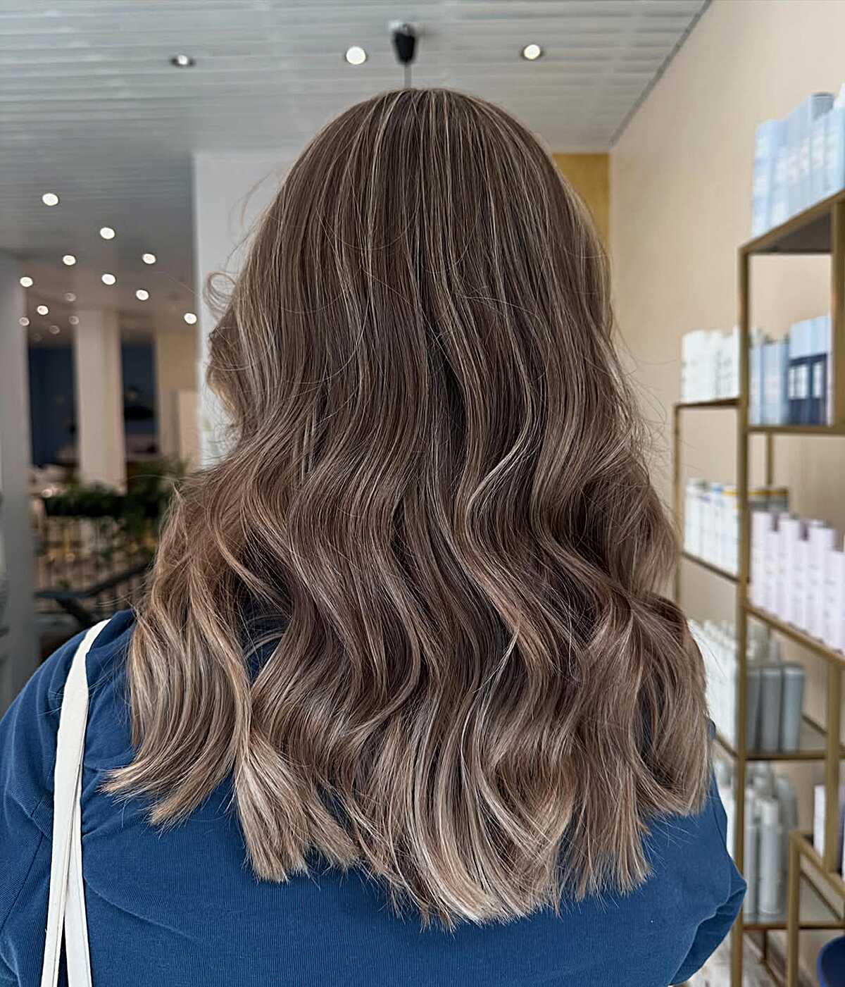 Medium wavy lob with ashy latte brunette tones