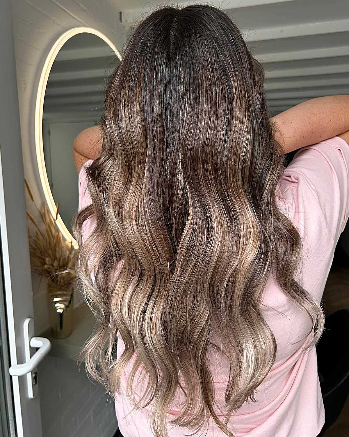 Long wavy brunette hair with creamy blonde ombre ends
