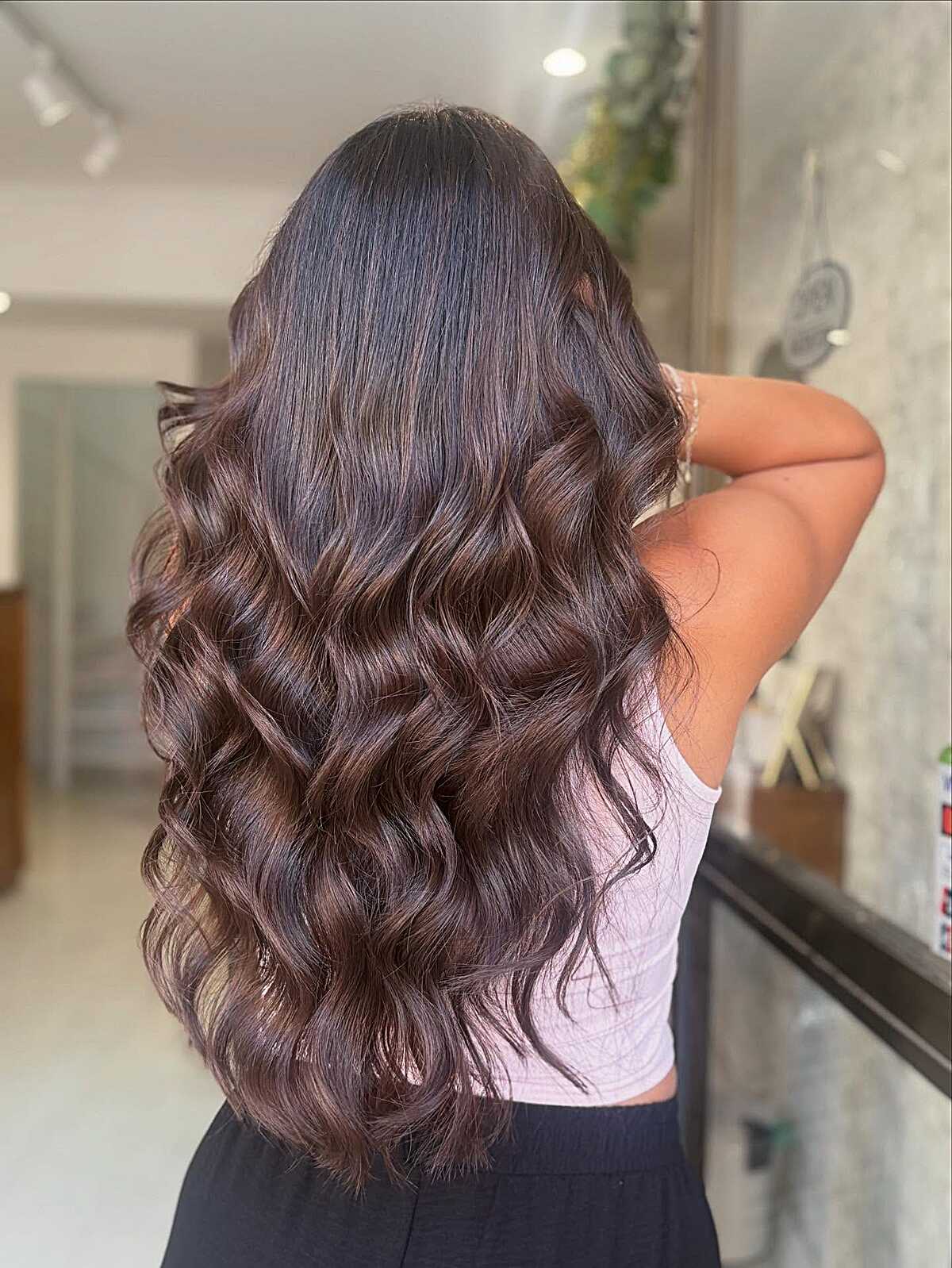 Long dark cocoa waves with a hint of burgundy warmth