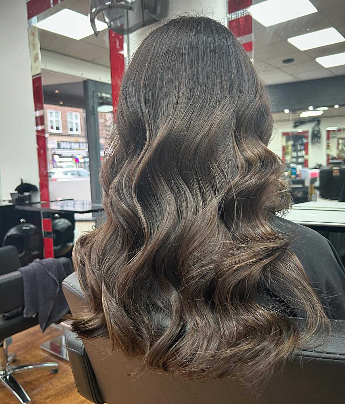 Deep brunette waves with soft warm brown highlights