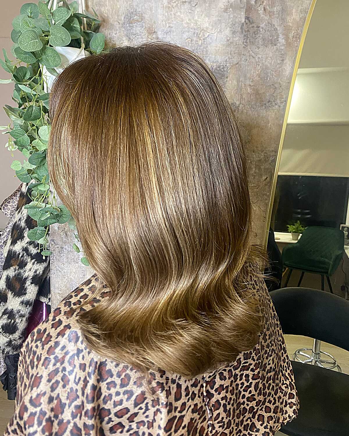 Medium-length golden toffee brunette with curled ends