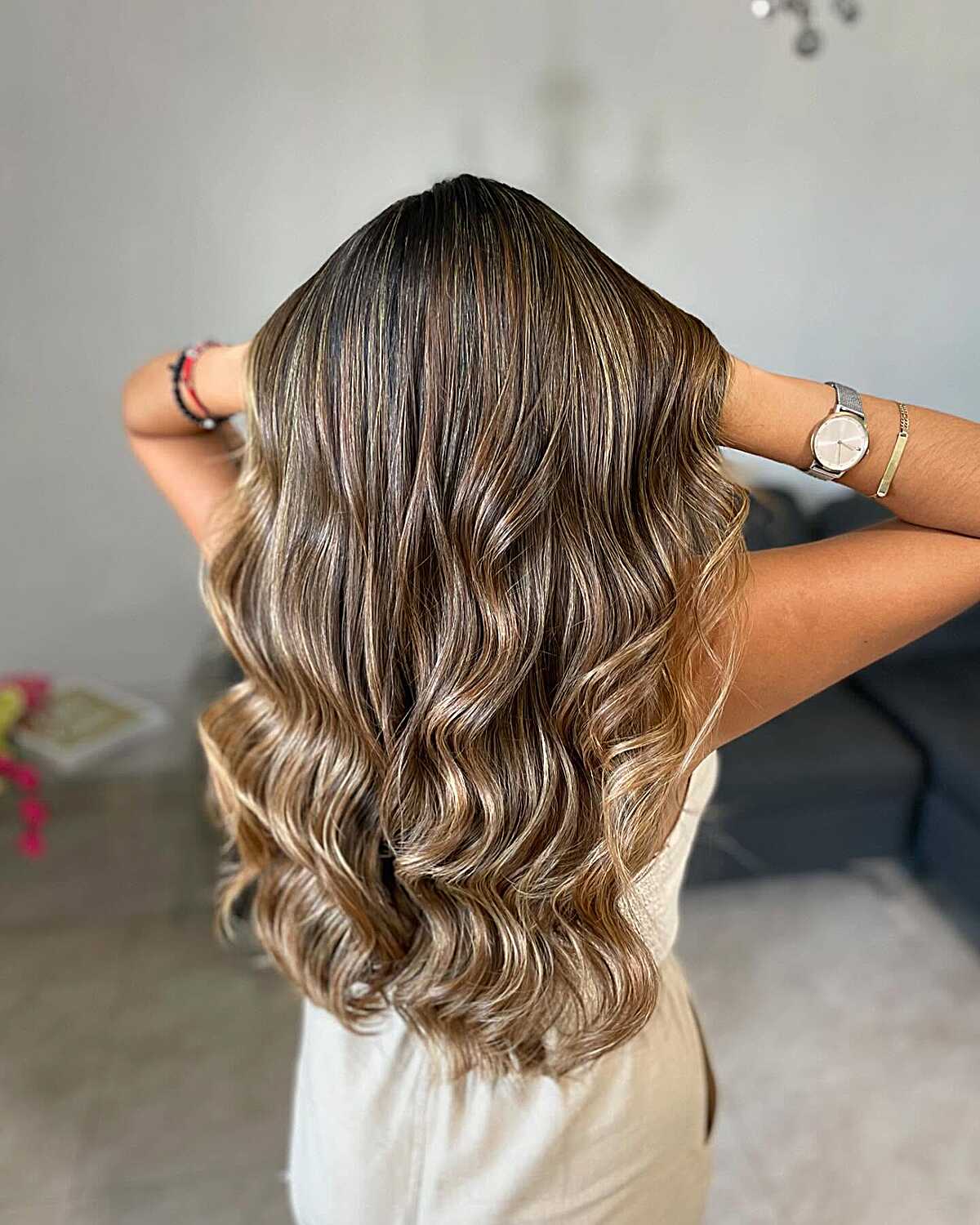 Dark brunette waves with bold latte ribbon highlights