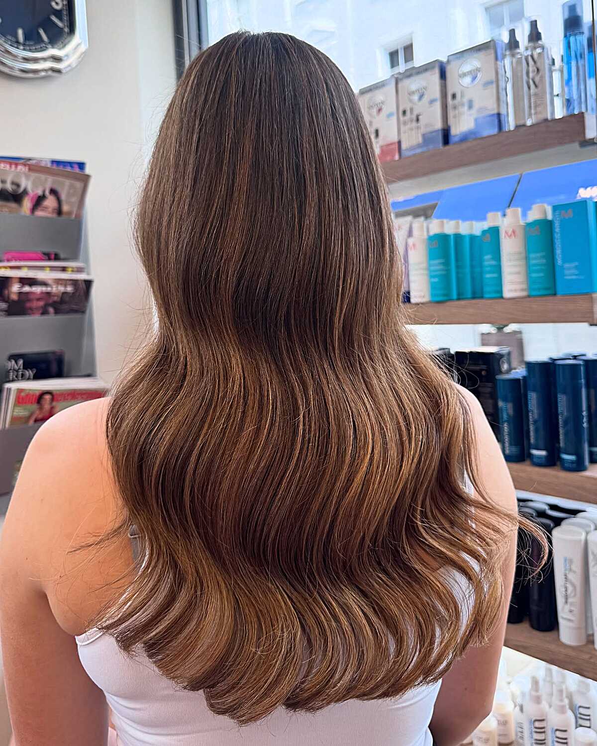 Long wavy brunette with warm sun-kissed latte tones