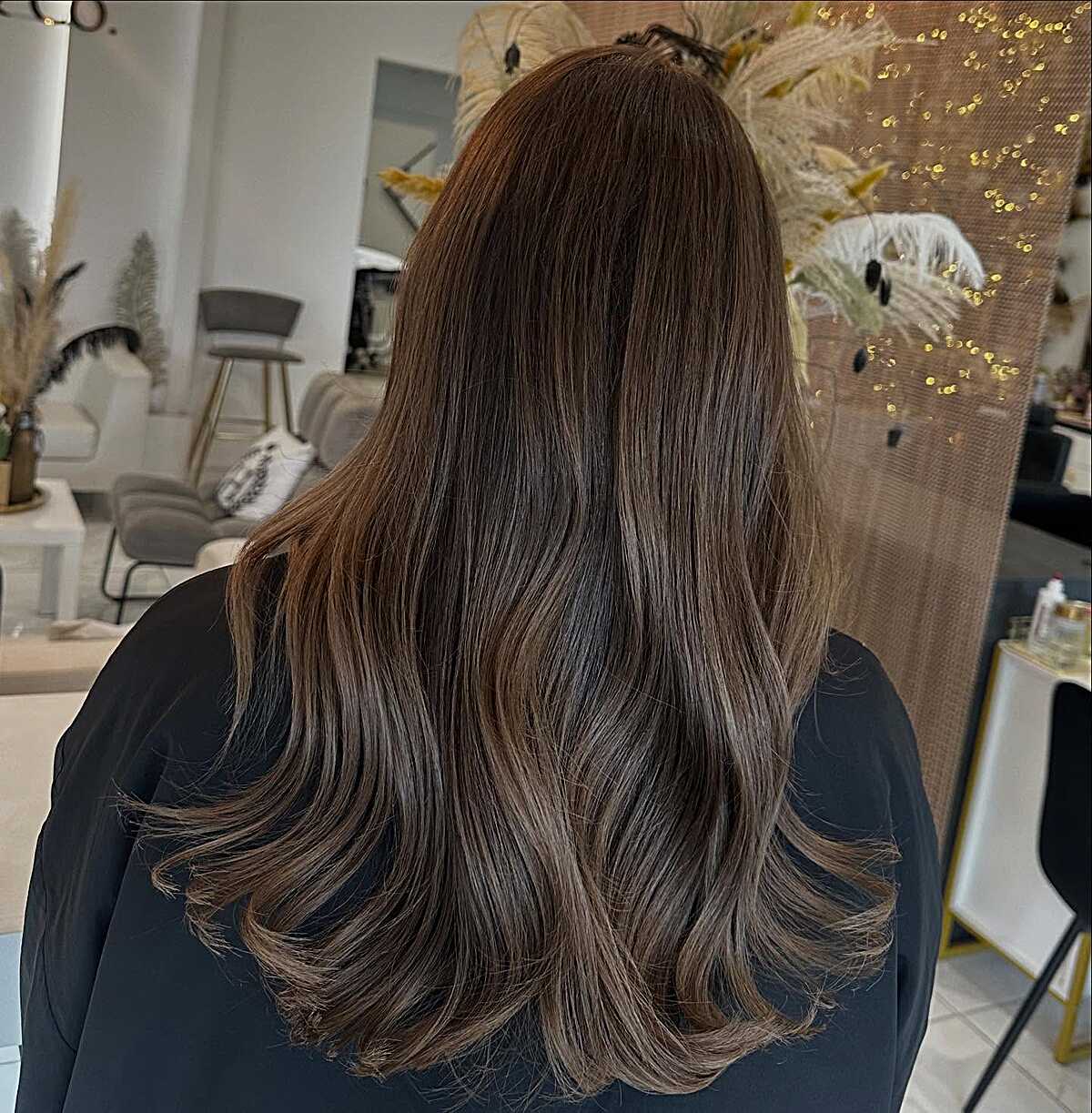 Long dark mocha brunette with subtle warm ends