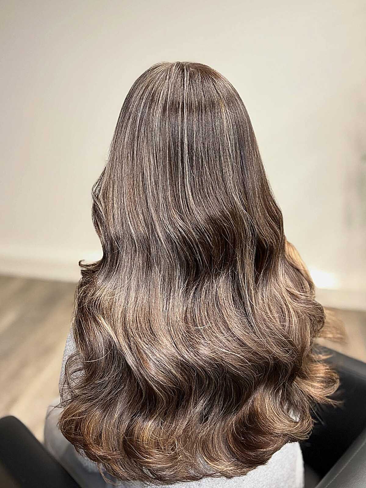 Long warm cocoa brown hair with soft curled ends