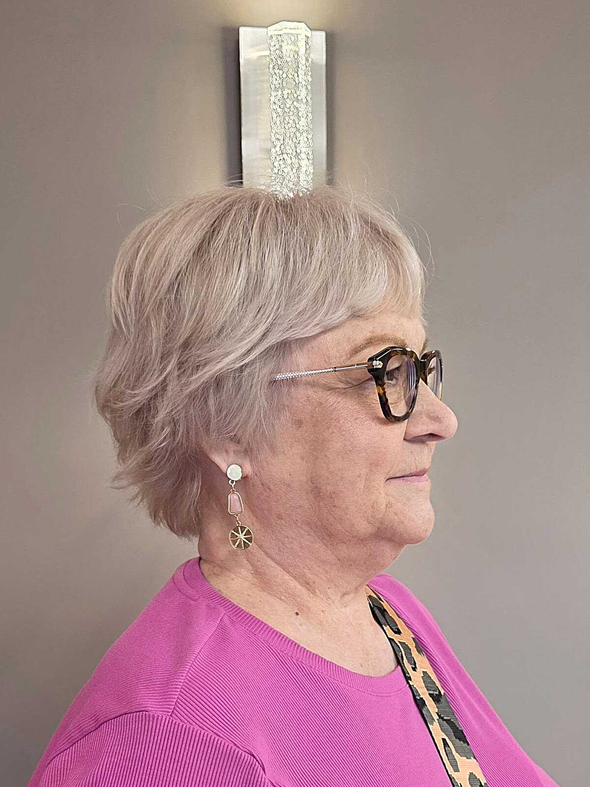 Soft lilac-toned bixie with flipped ends and glasses