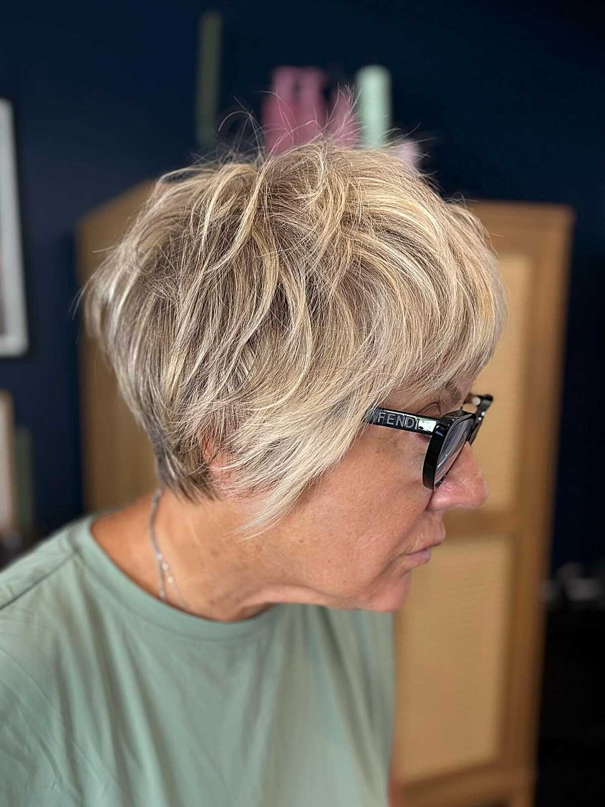 Warm blonde textured bixie from behind with glasses