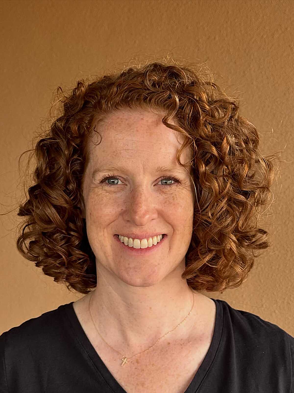 Natural copper red curly bob with spiral definition