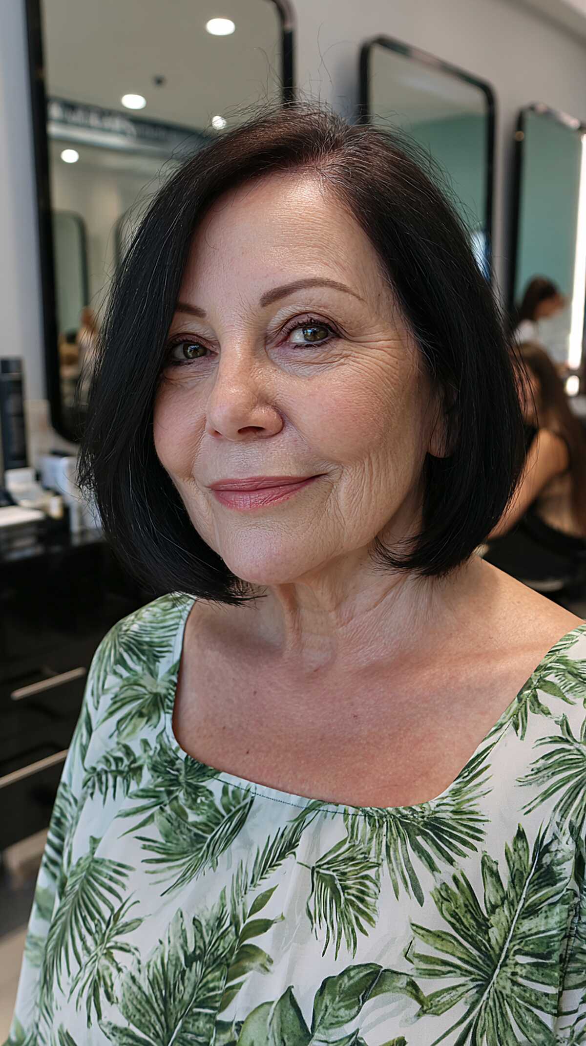 Dark brunette chin-length bob with a center part