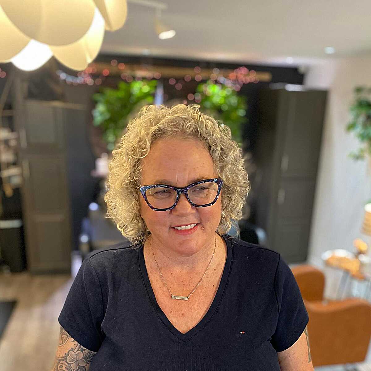 Soft blonde curly bob on fine hair with glasses