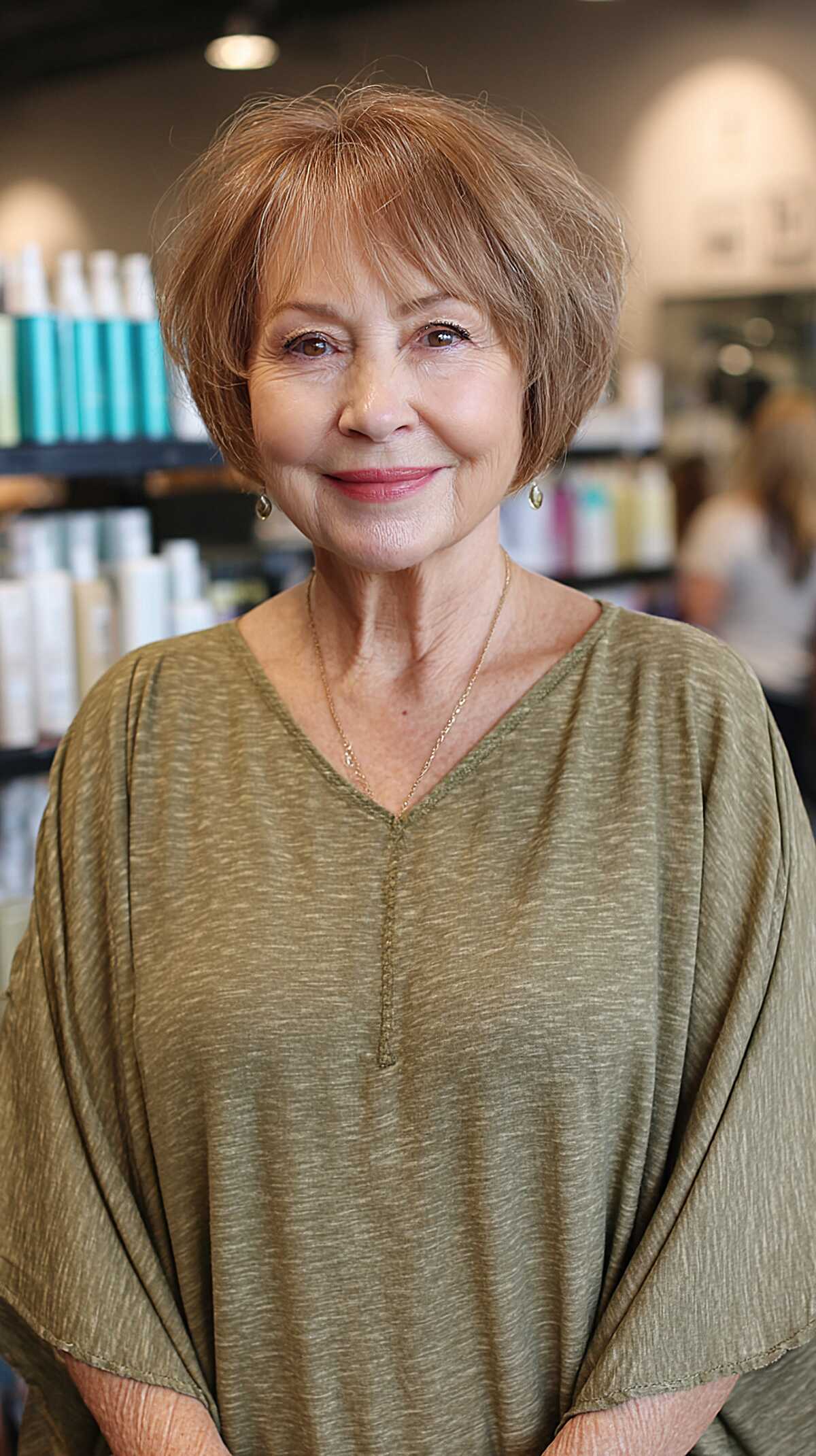 Short rounded bob in soft copper with wispy bangs