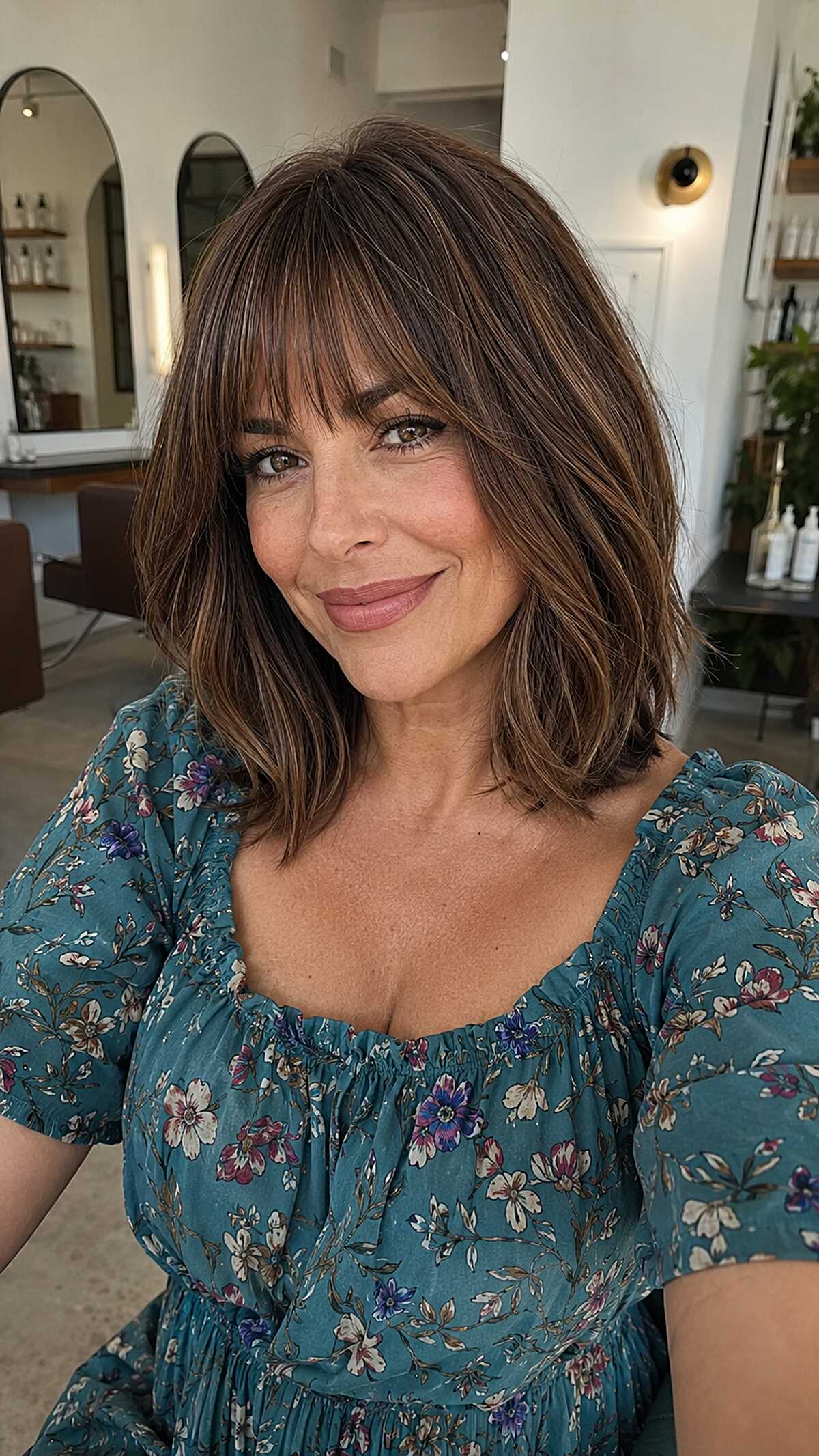 Chocolate brunette lob with feathered curtain bangs