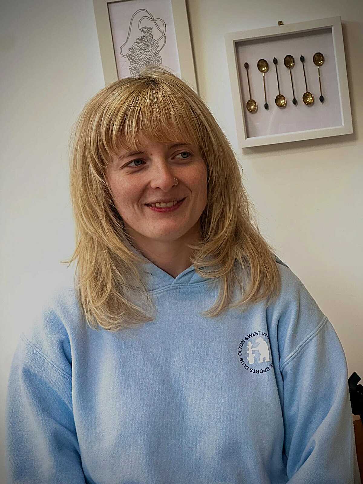 Honey blonde shoulder-length shag with full bangs