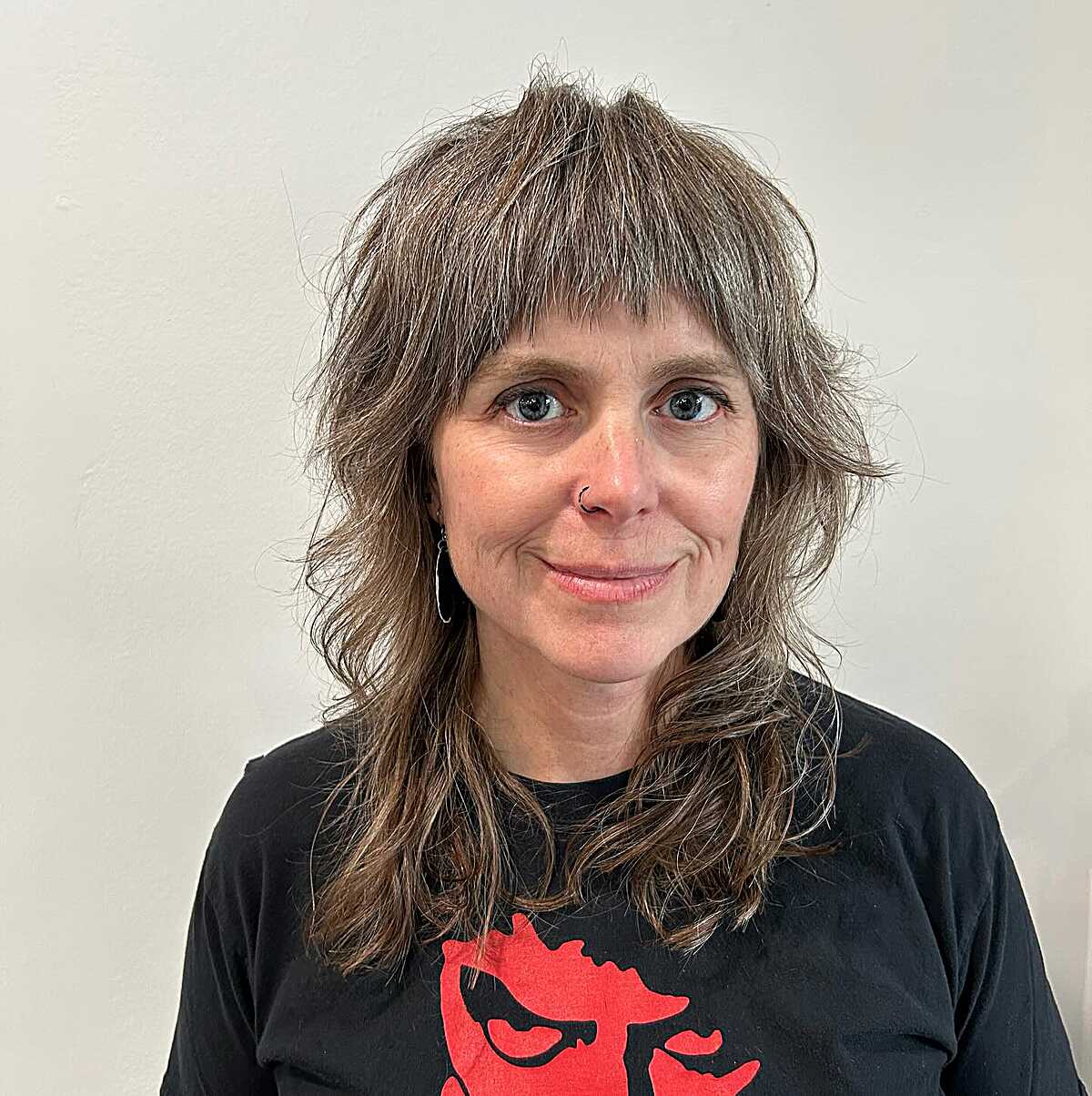 Medium brown wolf shag with gray streaks and bangs