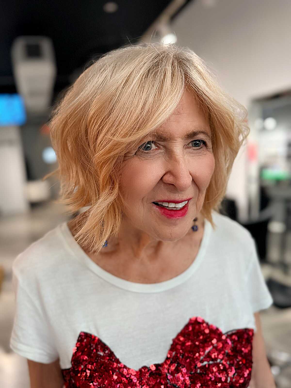 Peach blonde tousled shaggy bob on older woman
