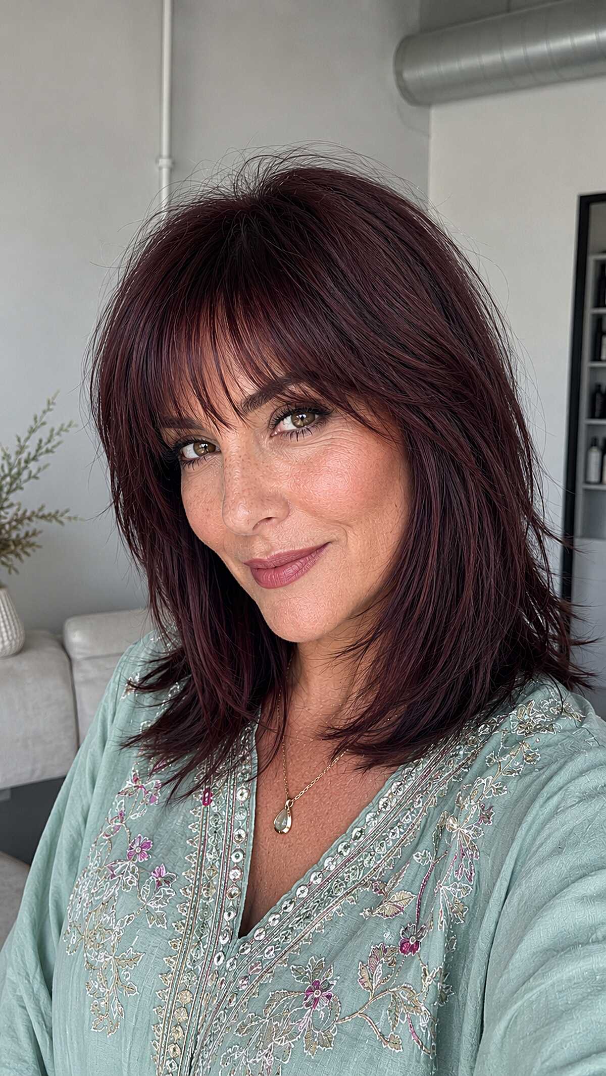 Deep plum wine colored lob with layered bangs