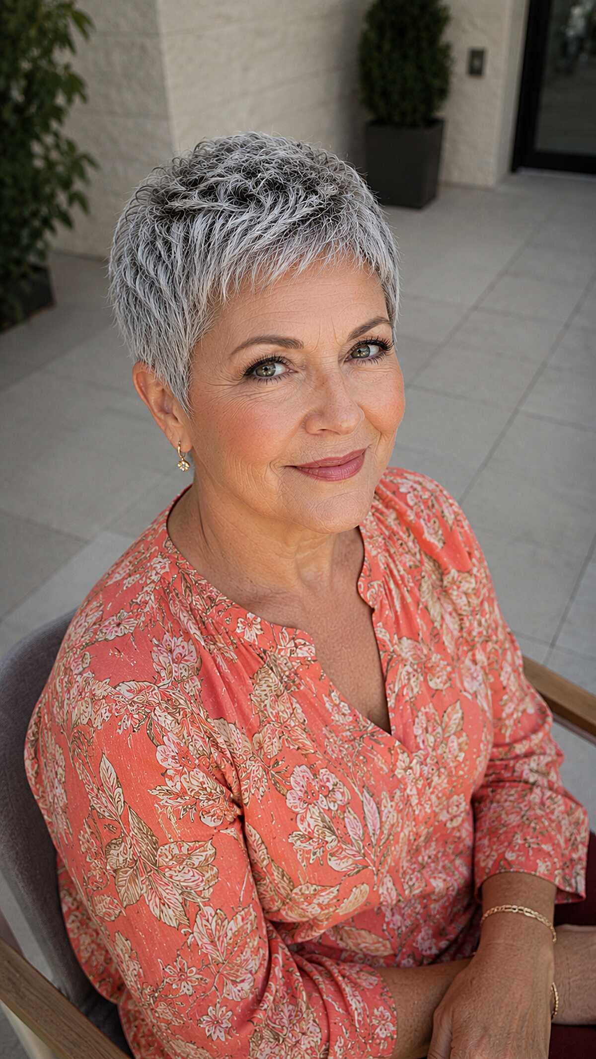 Short salt and pepper pixie with wavy texture