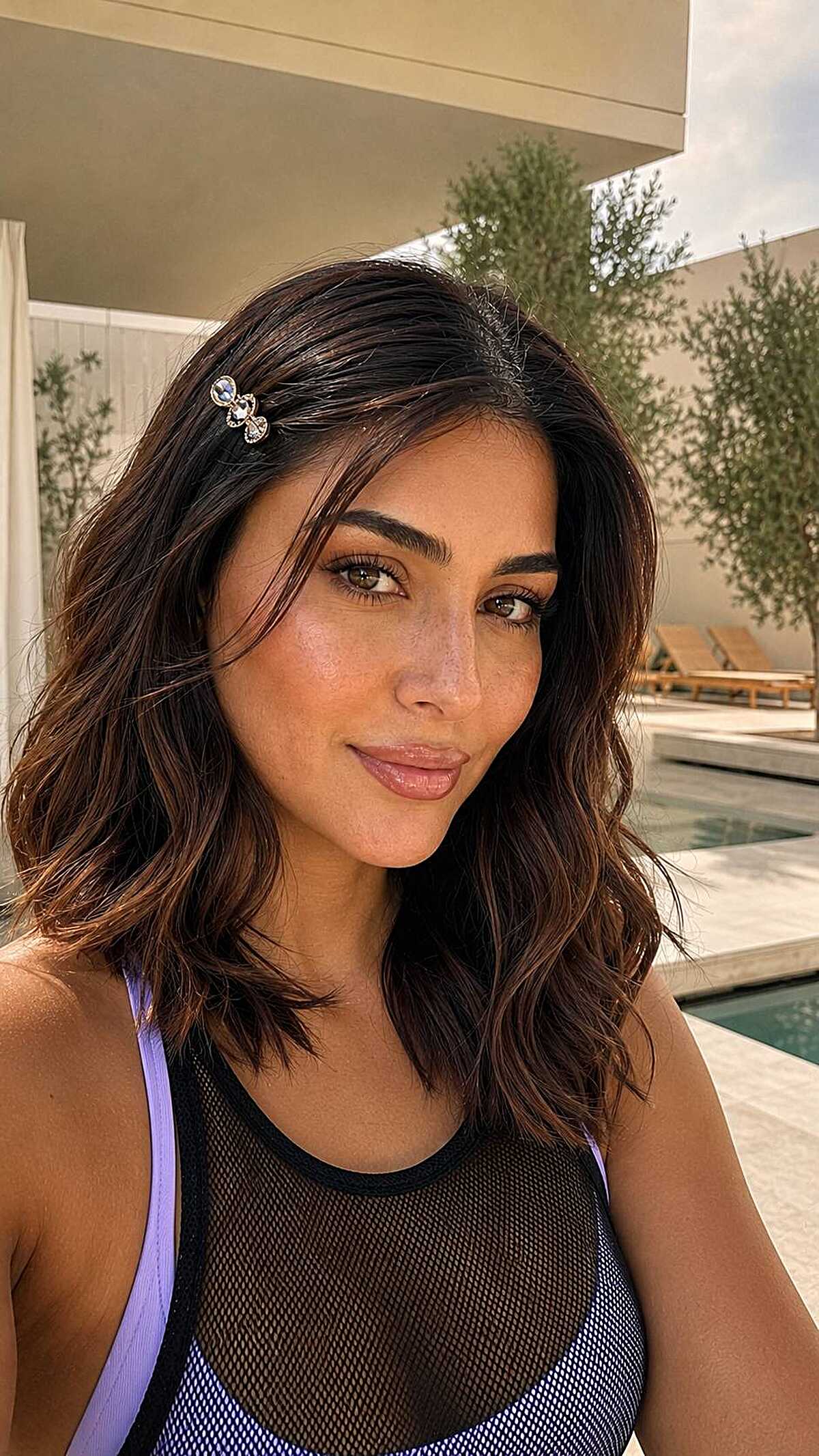 Dark wavy lob with small crystal hair clip