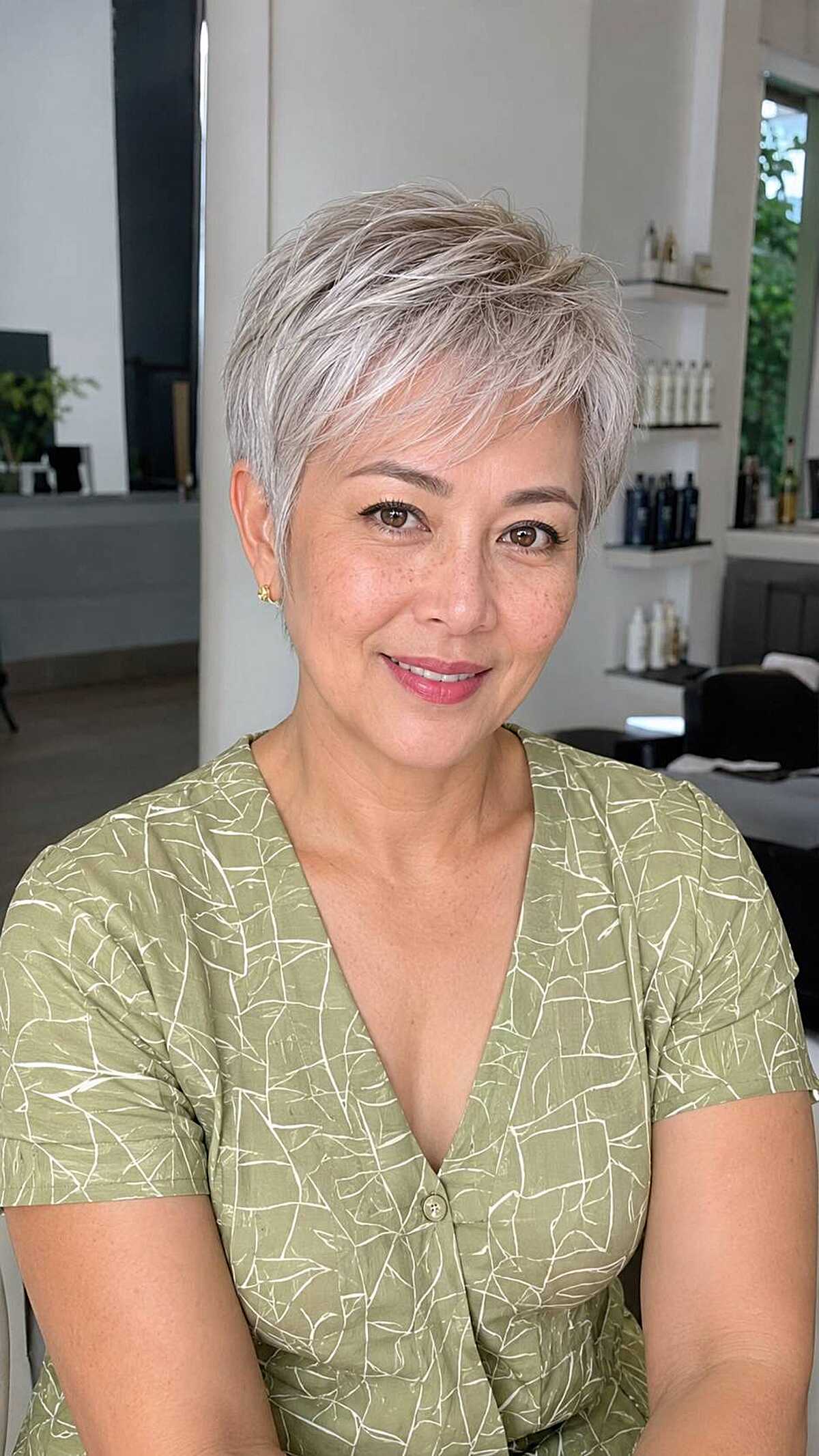 Short silver pixie cut with feathered fringe over 50