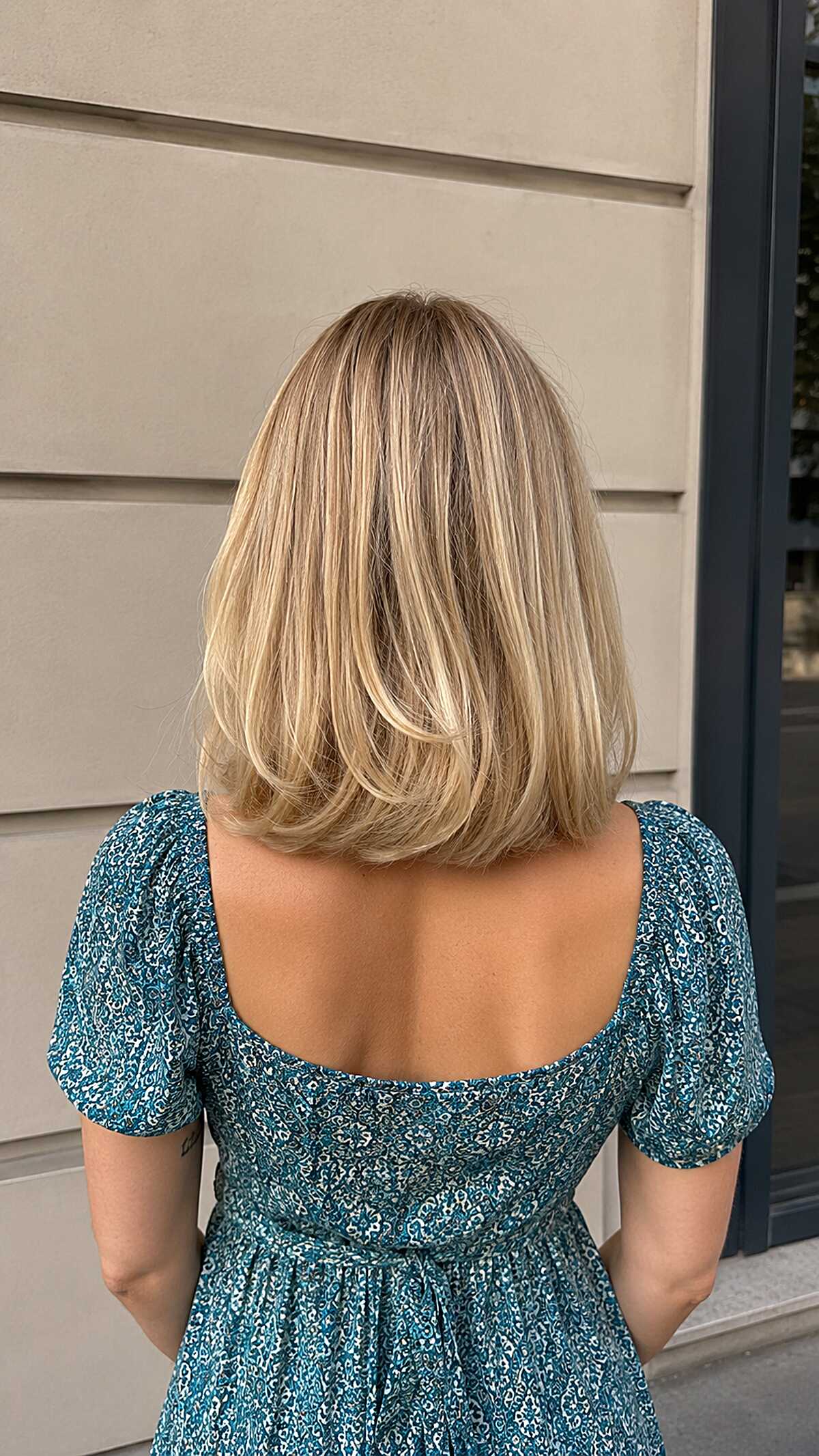 Shoulder-length golden blonde lob with flipped ends
