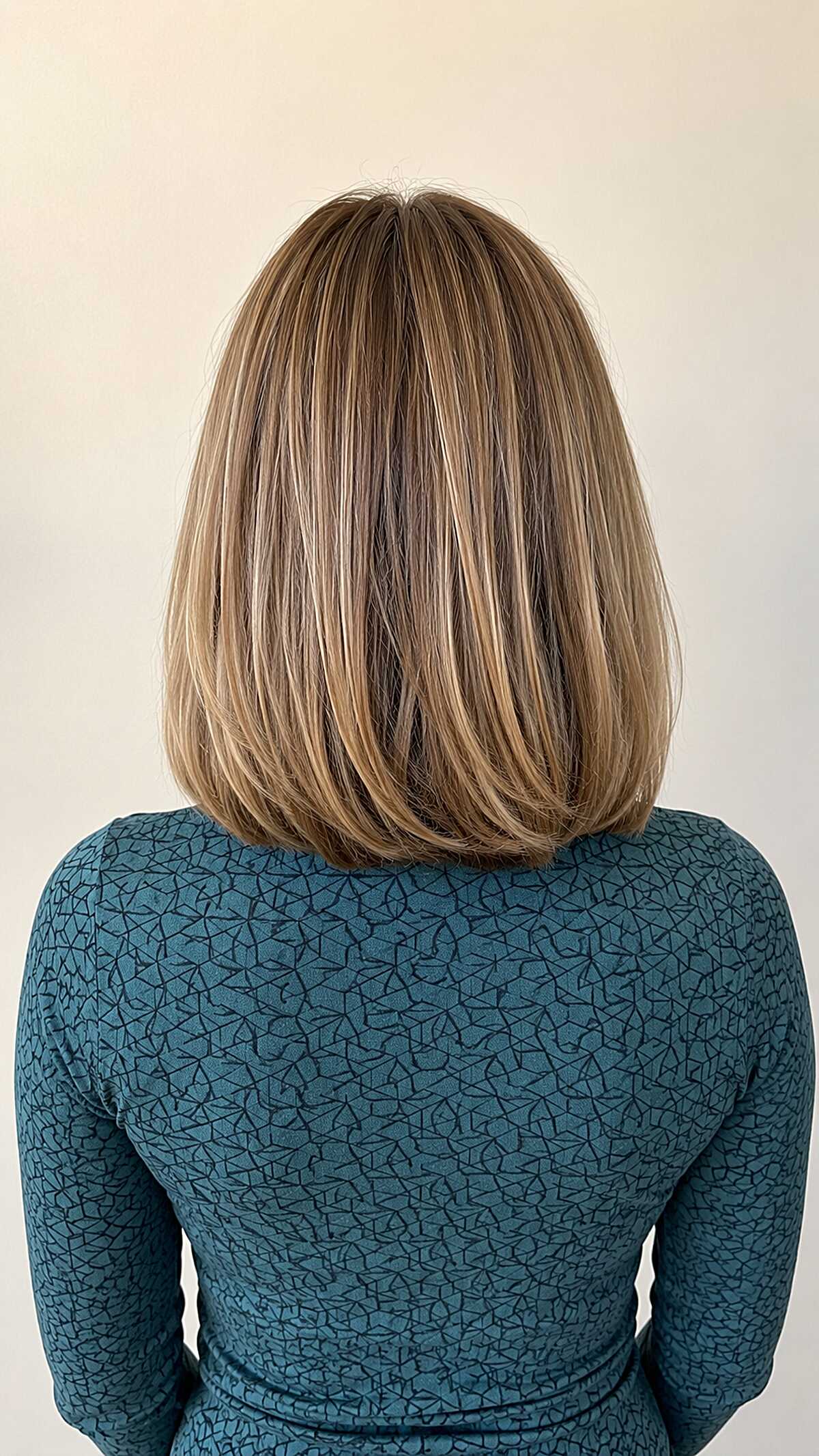 Classic bob with honey bronde highlights from behind