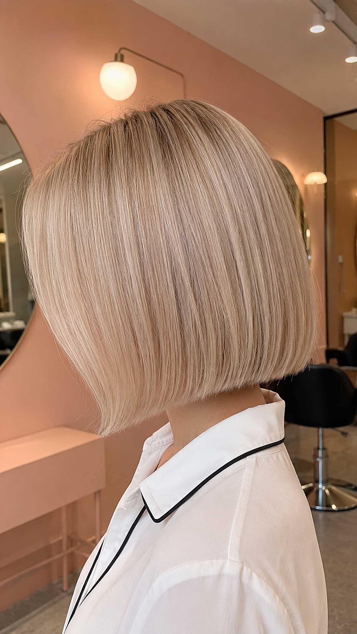 Sleek jaw-length porcelain blonde bob from behind