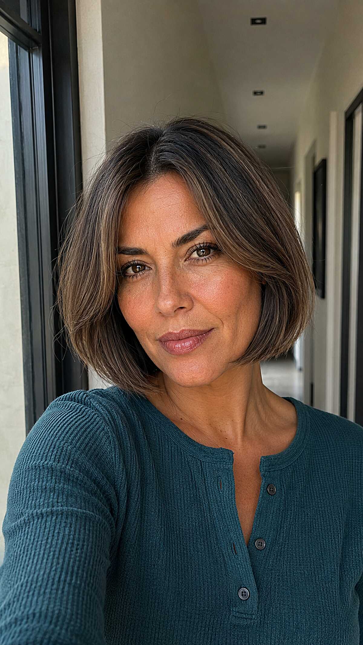 Simple brunette bob with center part and blunt ends