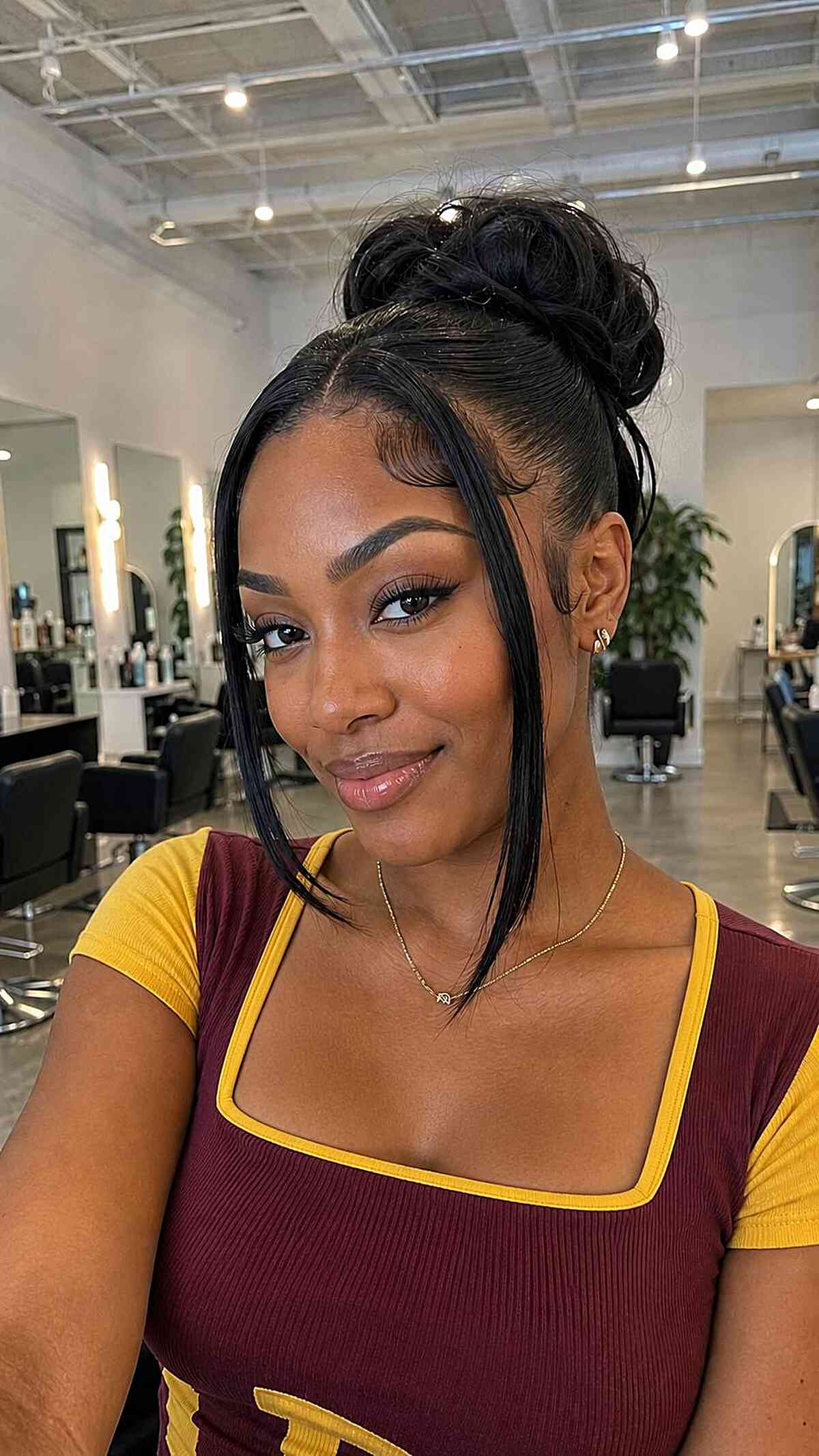 Chic Sleek High Bun with Face-Framing Strands
