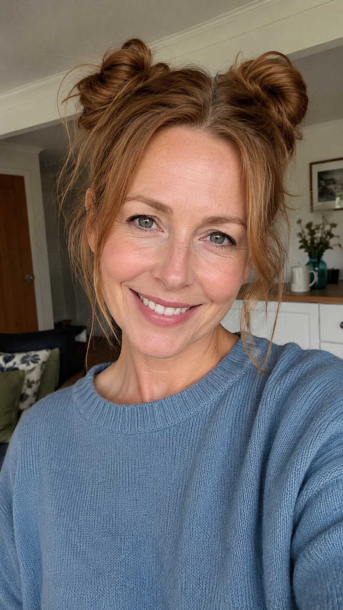 Copper double messy buns with tousled face framing