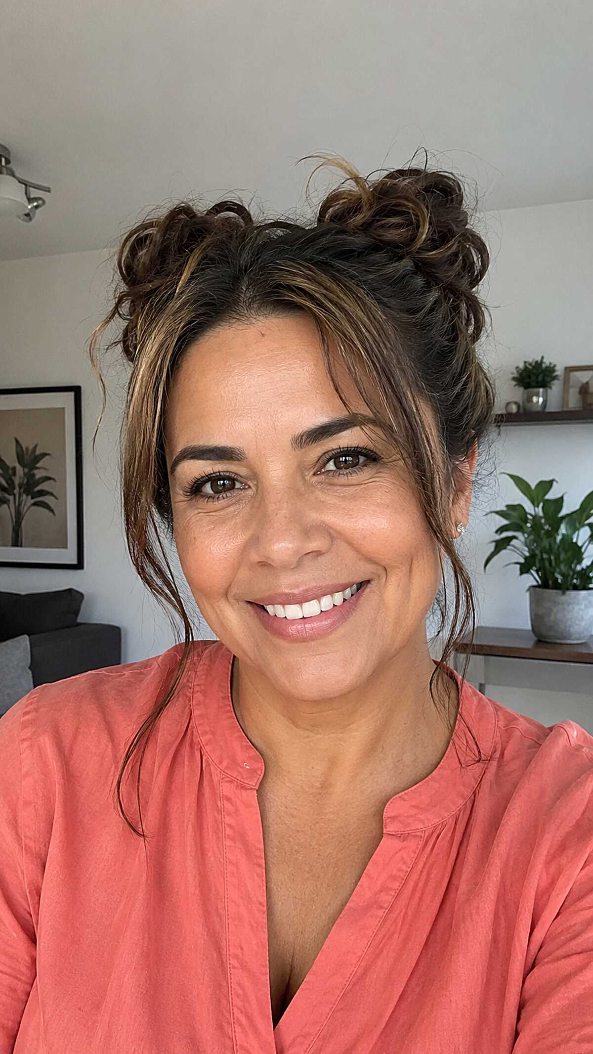 Playful double messy buns with caramel highlights