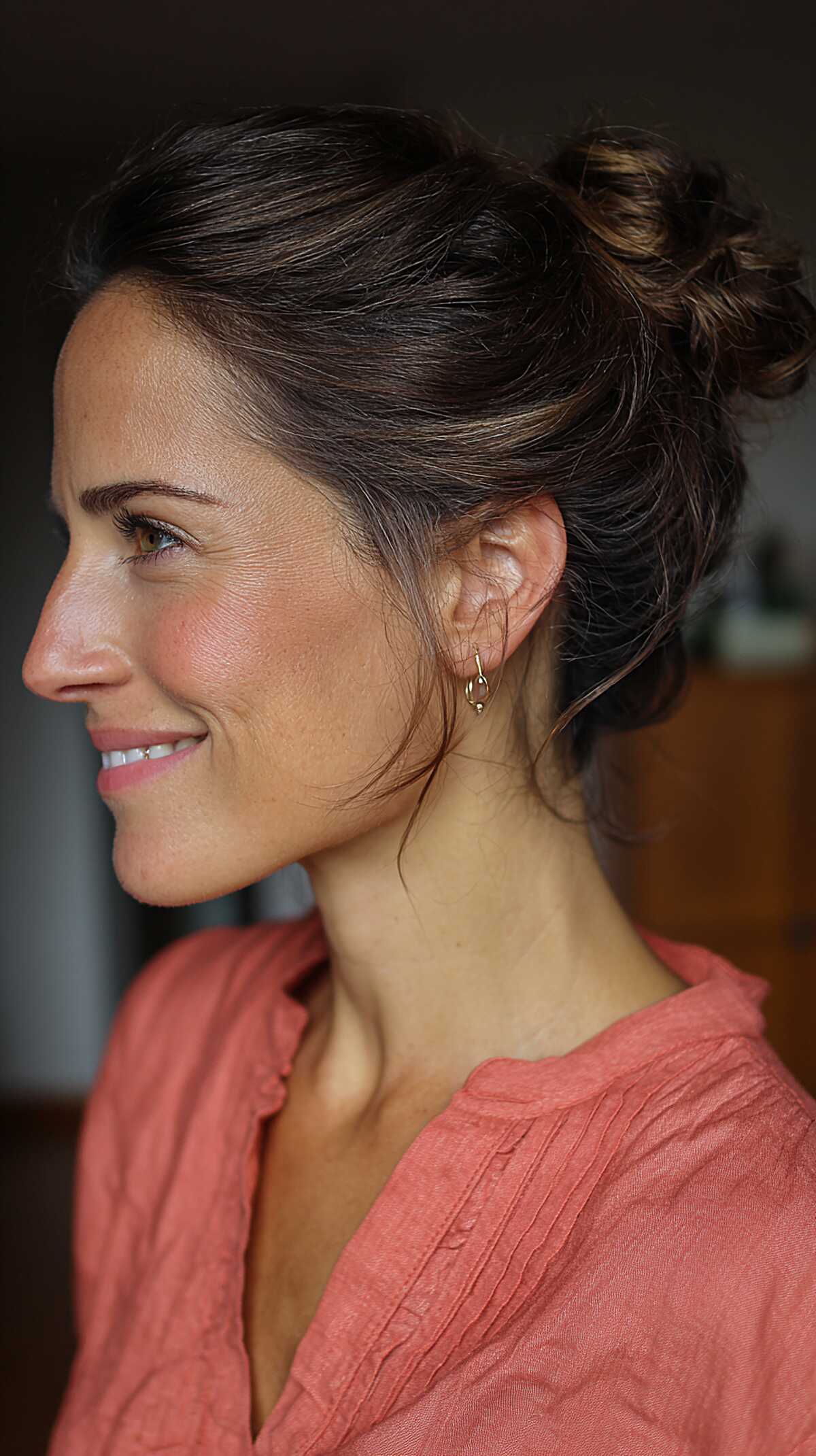 Sleek dark brunette small bun with minimal flyaways