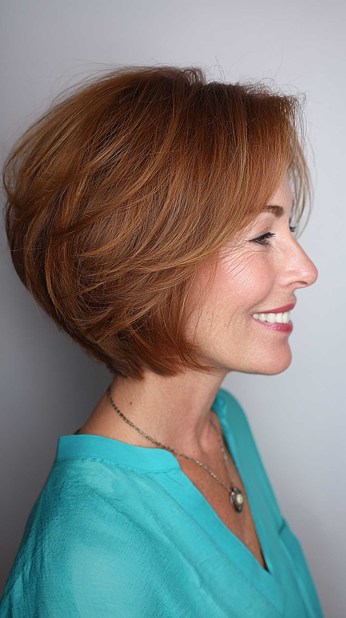 Warm Auburn Chin-Length Stack with Lifted Crown and Flippy Ends