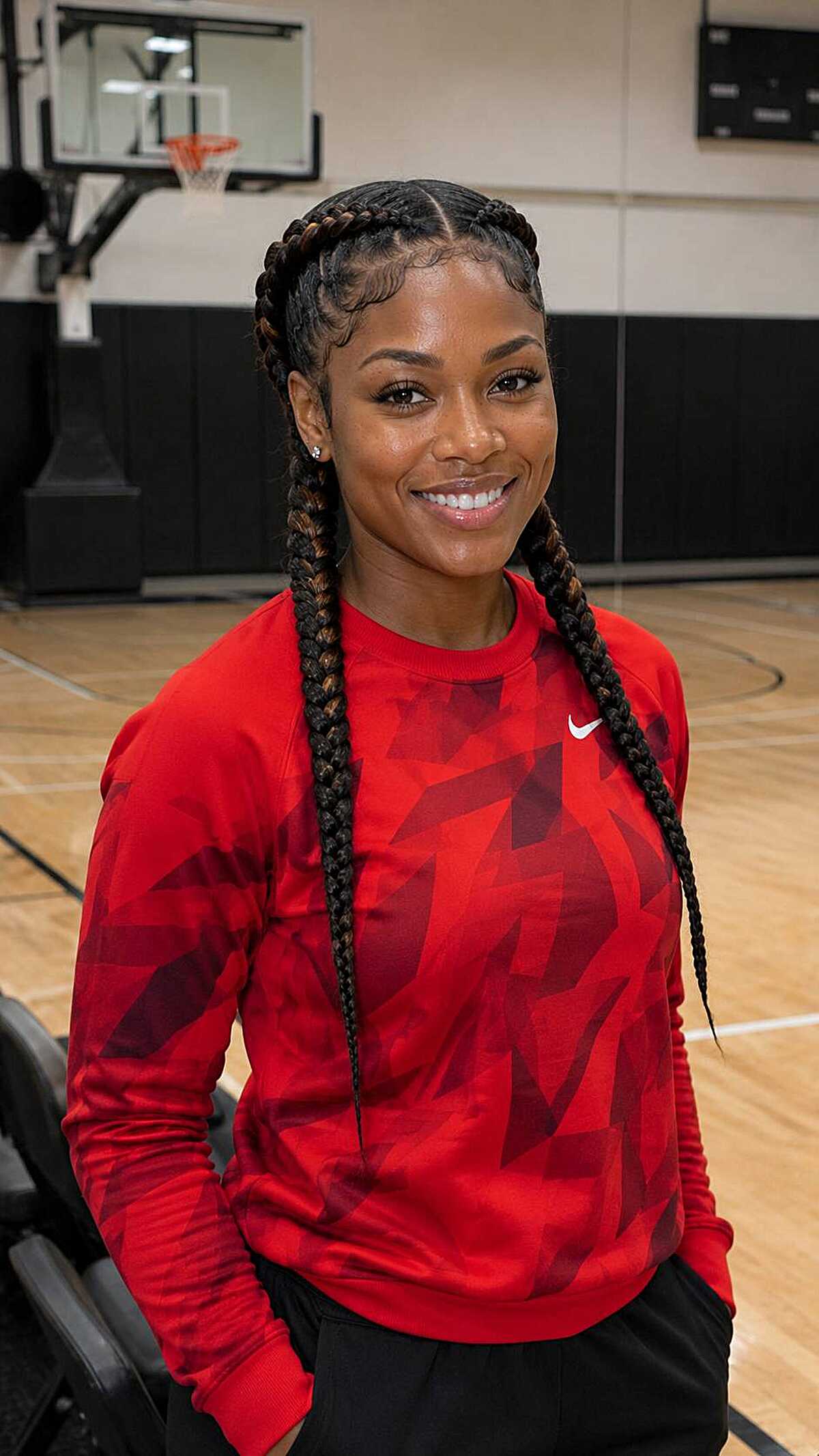 Four thick feed-in braids hanging past the shoulders
