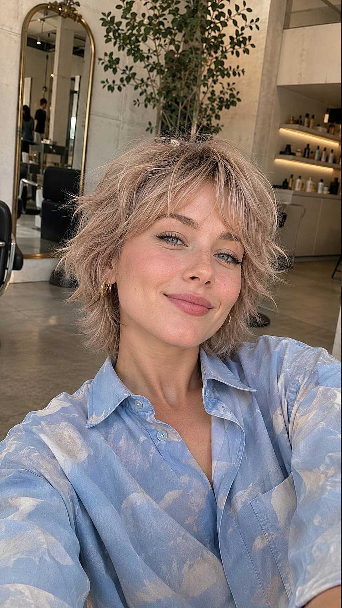 Rosy blonde tousled short shag with wispy fringe