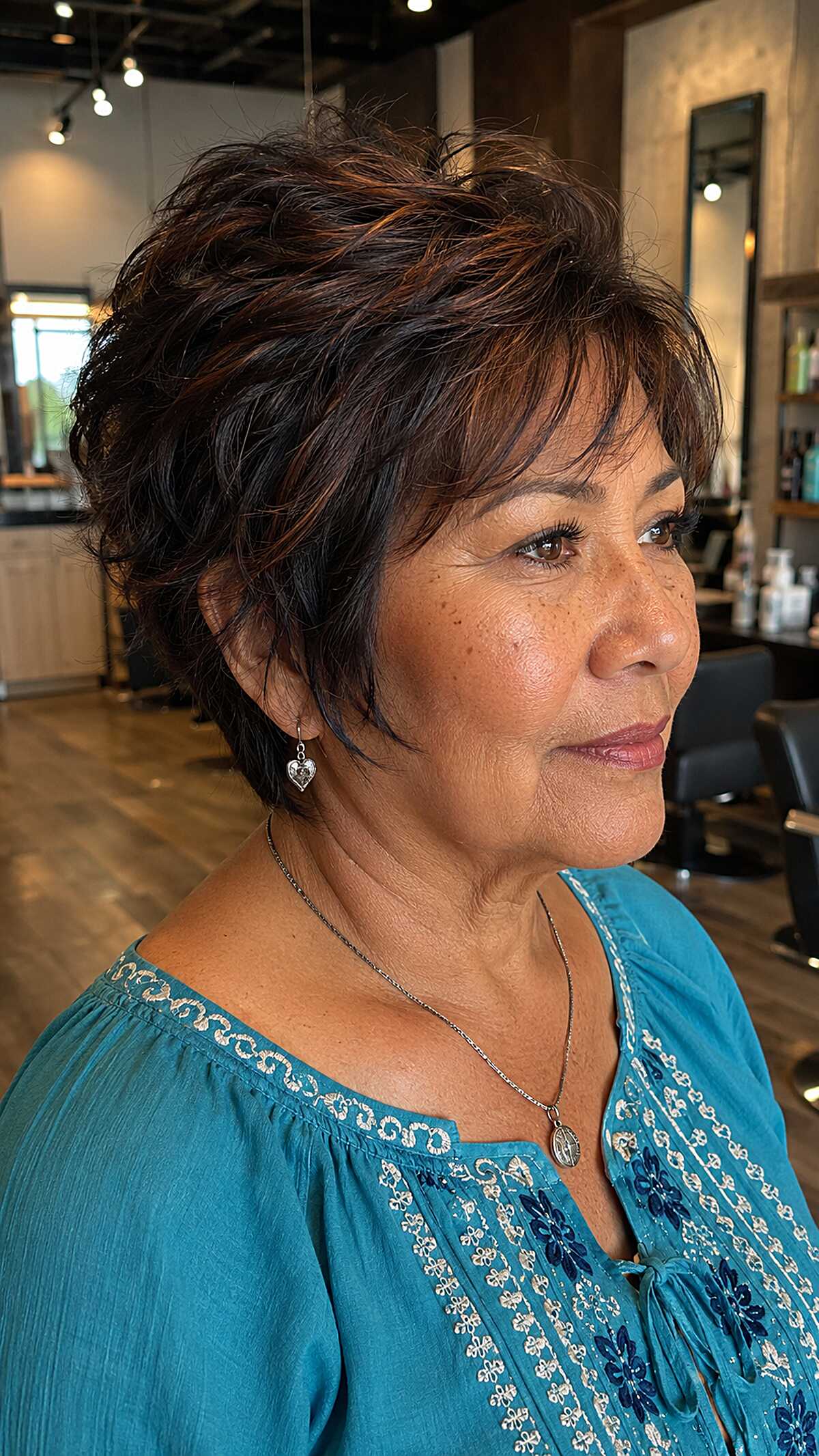 Choppy dark brunette pixie with warm copper accents