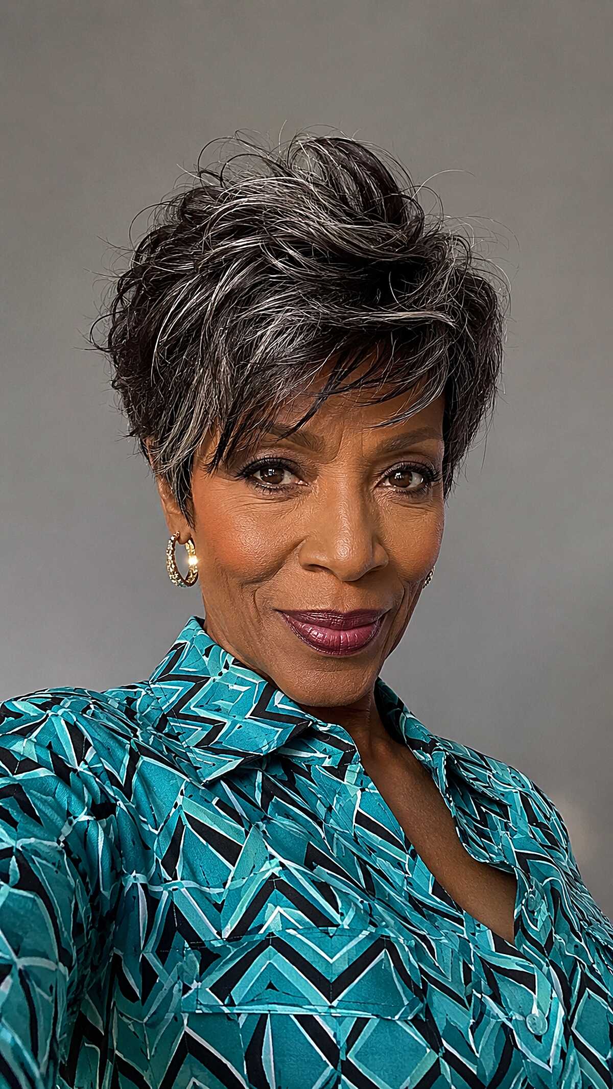 Swept-back silver pixie with dramatic height and texture