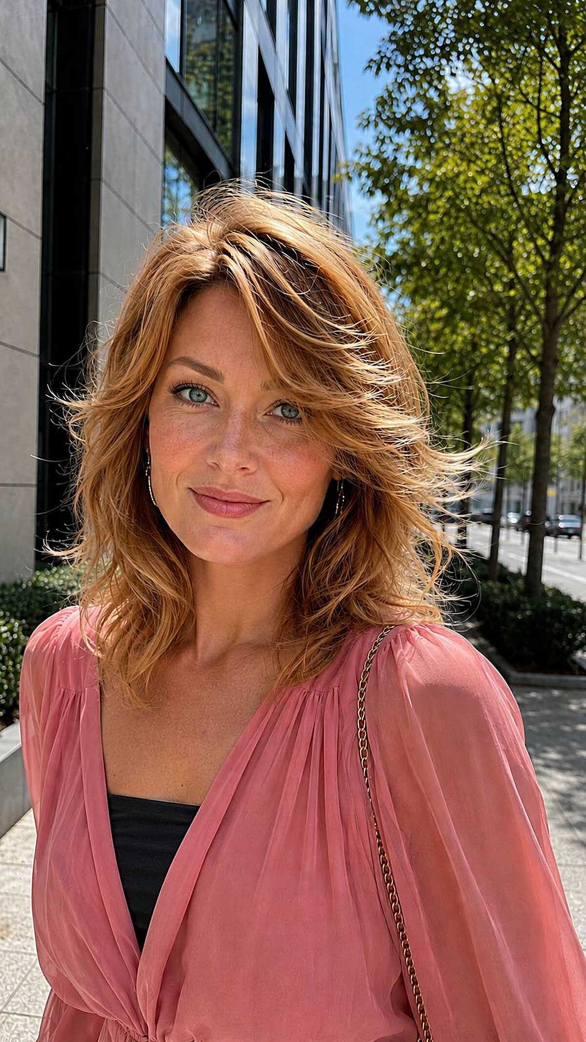 Copper strawberry blonde wavy shag with side part