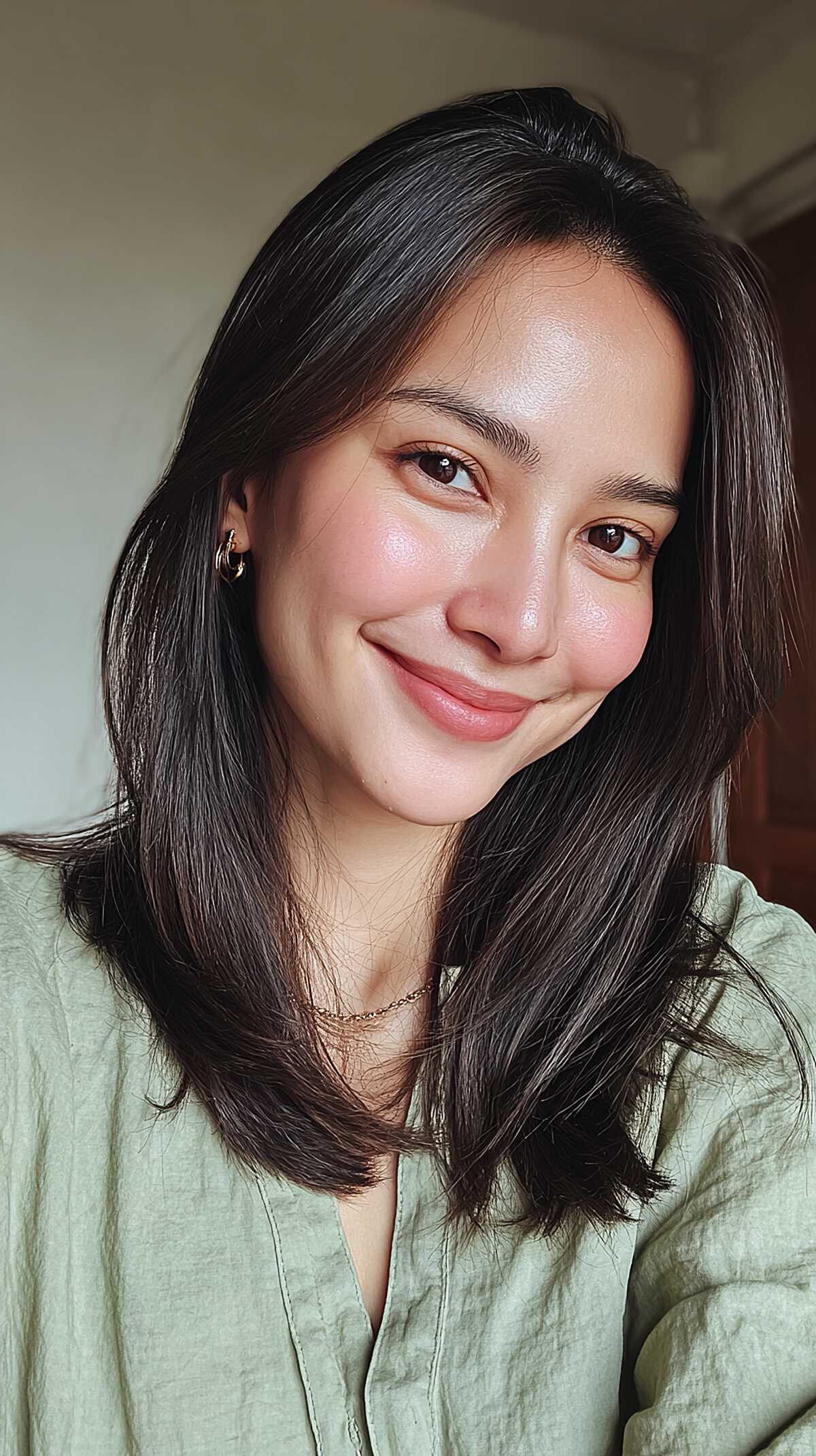 Dark shoulder-length lob with soft curtain face framing