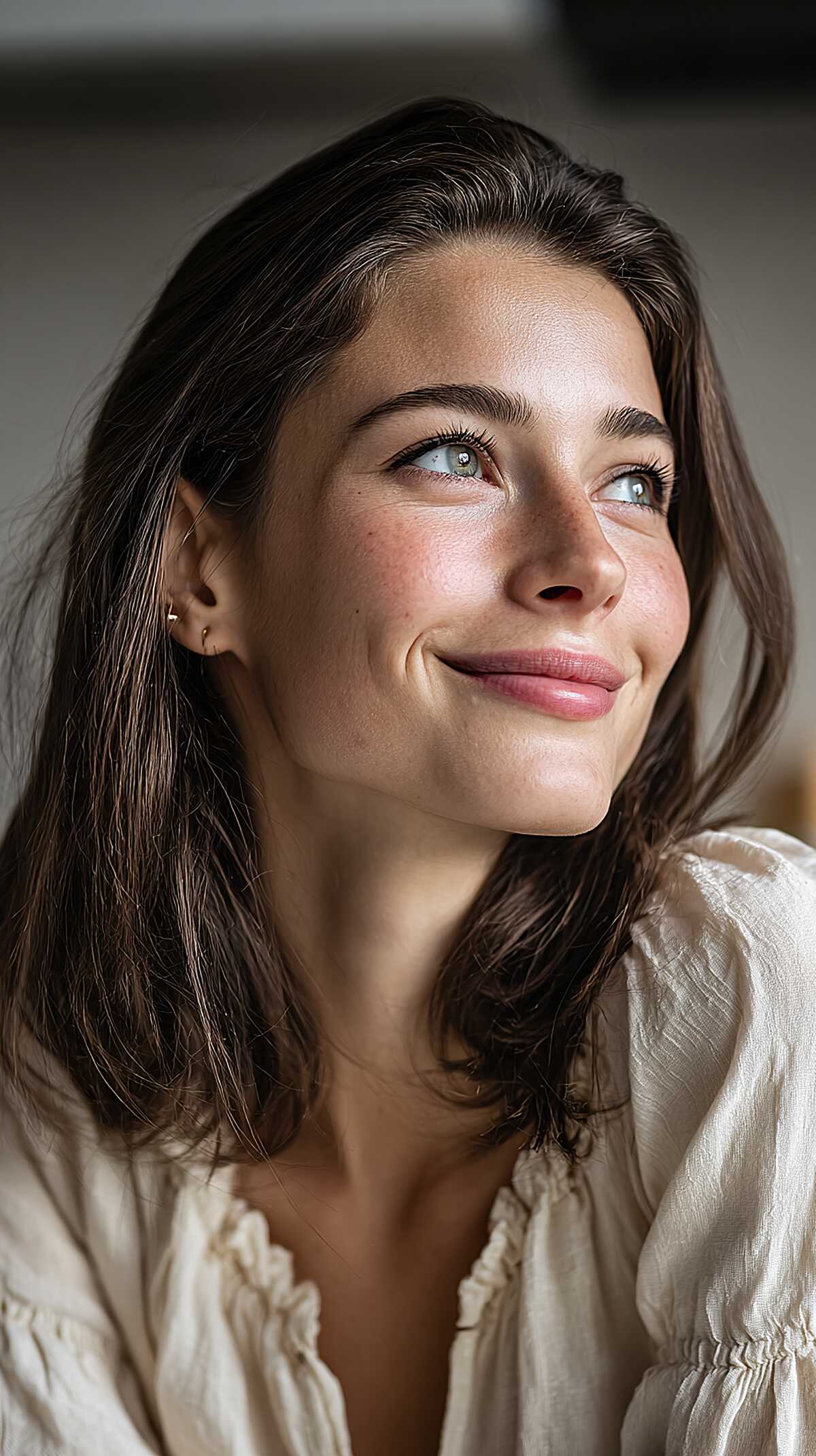 Dark brunette shoulder-length lob with natural texture