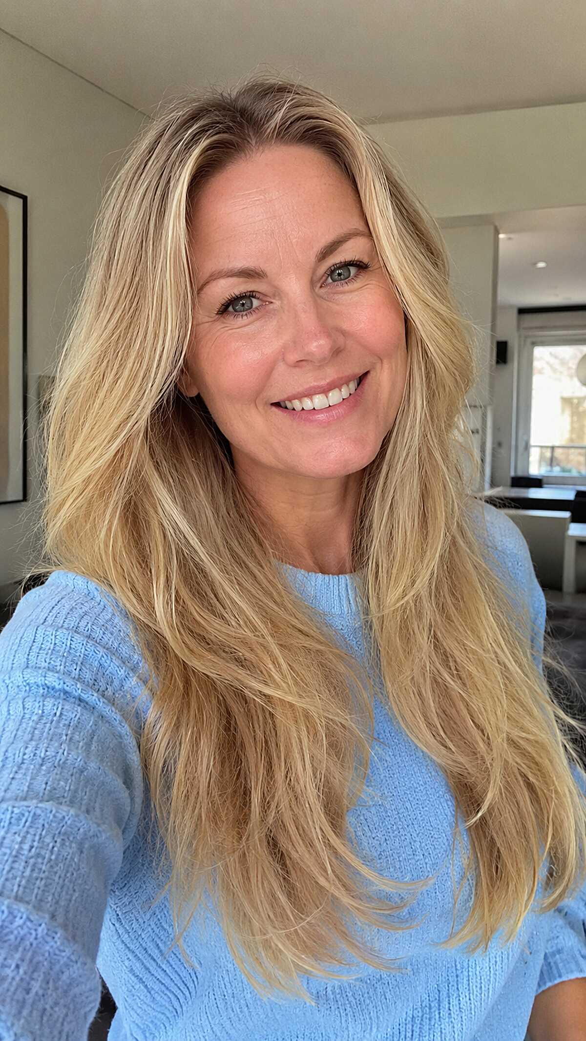 Sun-Streaked Blonde with Loose Feathered Ends
