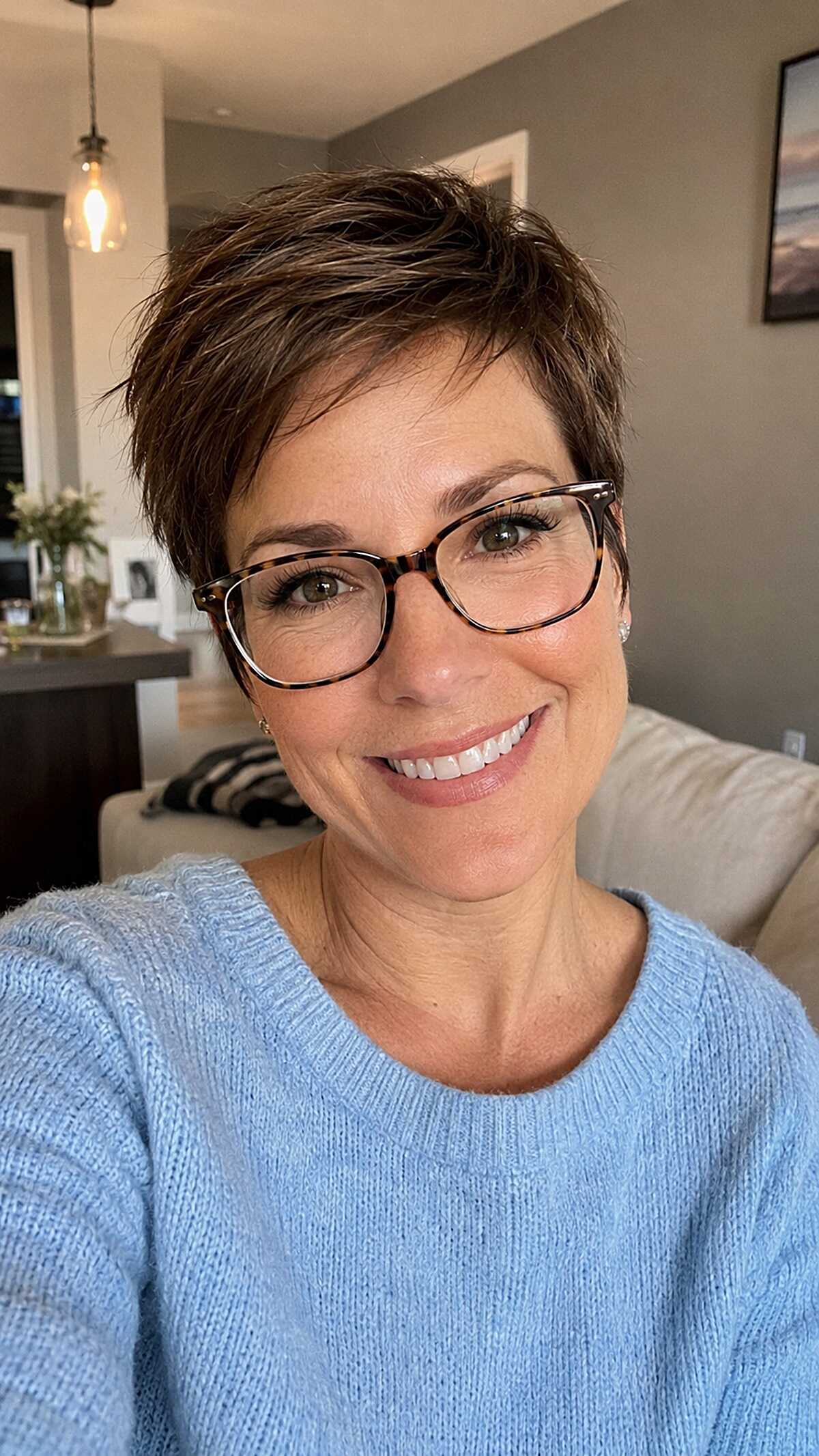 Choppy brunette pixie cut with feathered top layers