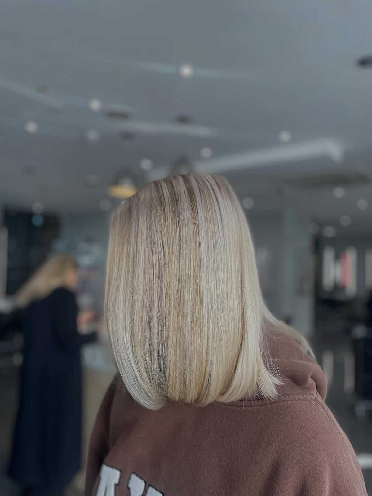 Short cool cream blonde bob with subtle inner glow