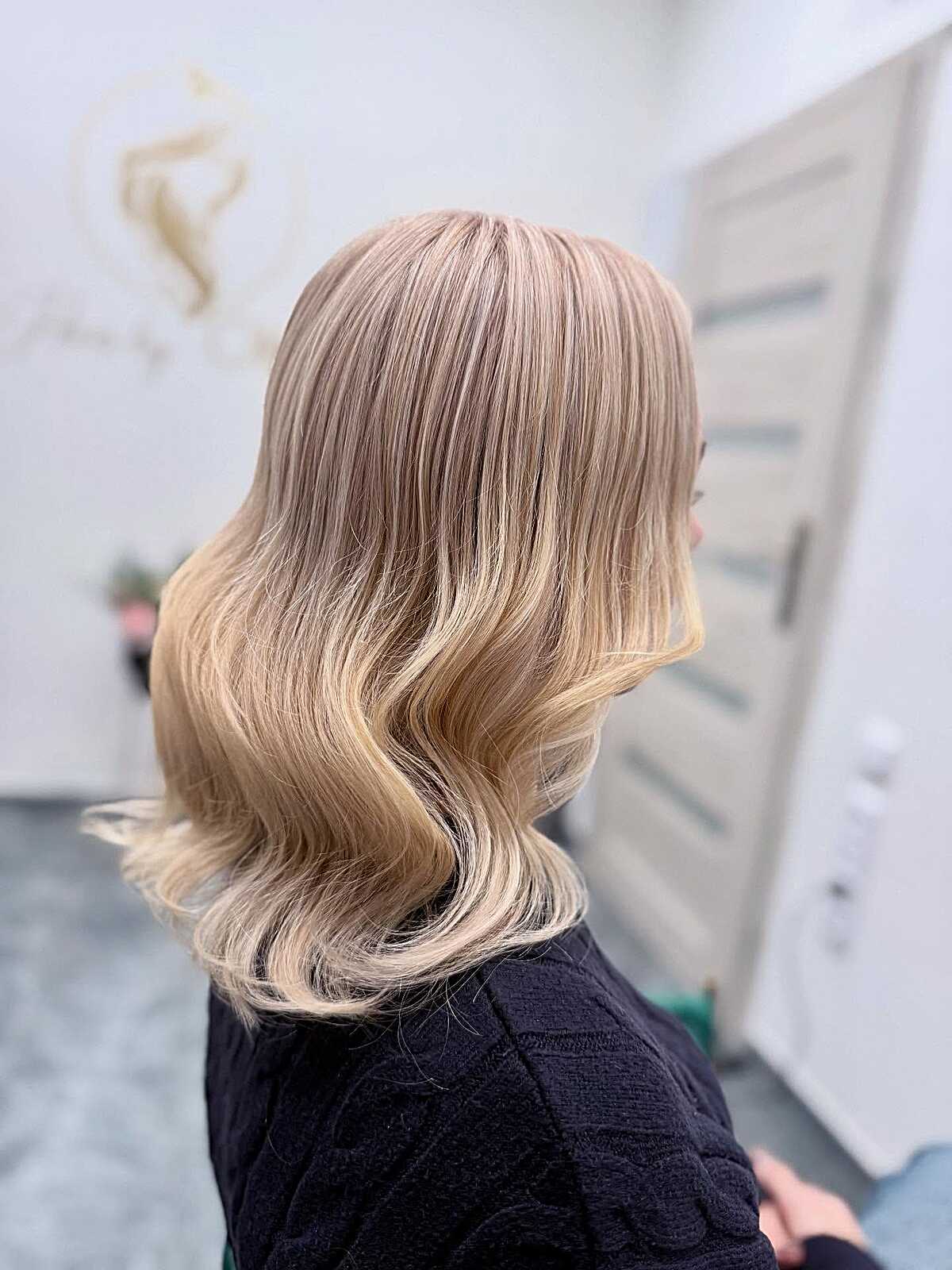 Medium blonde with rosy champagne tone and vintage curls