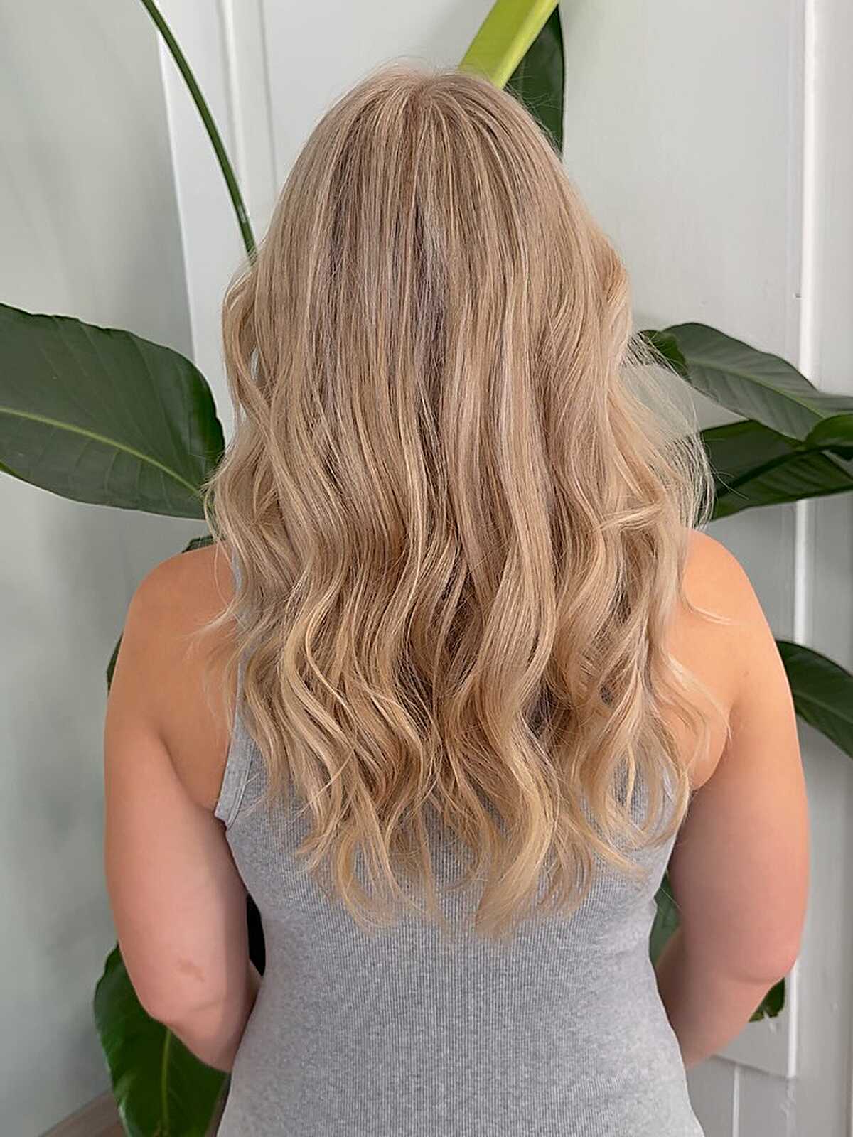 Long warm honey blonde waves with soft layering